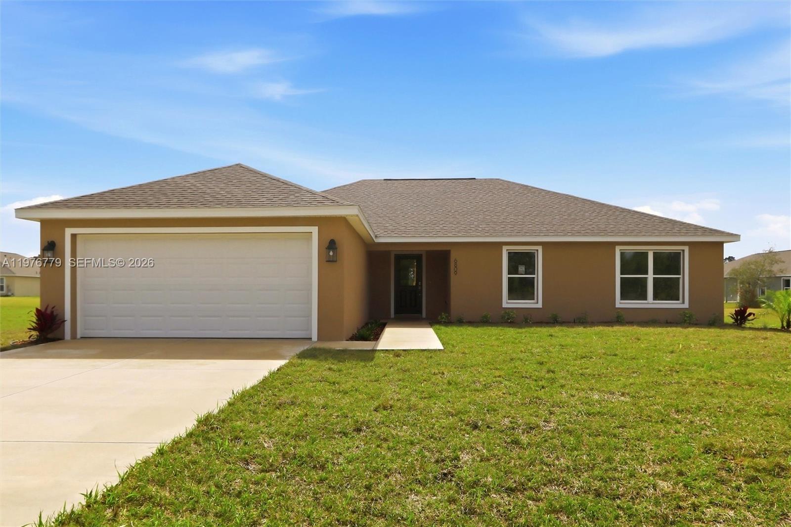 Welcome to the Lakewood model, a brand-new construction in the sought-after Sun ‘n Lake of Sebring Improvement District, where you can enjoy the golf community lifestyle without the restrictions of an HOA. Situated on an oversized nearly half acre lot, this newly completed 4-bed, 2-bath, 2-car garage home offers over 1,800 sqft of modern living space.
Step inside and you’ll immediately notice the light, open layout and neutral color palette that makes the home feel bright and clean. The kitchen is designed to impress with quartz countertops, shaker cabinetry, stainless steel appliances, and plenty of counter space, making it ideal for both everyday living and entertaining guests. The spacious primary suite provides a relaxing retreat with dual sinks, a walk-in shower, and generous space to
unwind, while the split floor plan offers privacy for family and visitors. Additional features include an inside laundry room, irrigation system, and finished 2-car garage. Living in Sun ‘n Lake means more than just owning a home — it’s a lifestyle. Residents enjoy access to two championship golf courses, tennis and pickleball courts, community pool, fitness and recreation center, dining, and year-round activities, all within one of Sebring’s most desirable communities. New homes on oversized lots in Sun ‘n Lake are hard to find, and this one is move-in ready. Schedule your showing today and see why so many buyers are choosing Sun ‘n Lake for their next home.