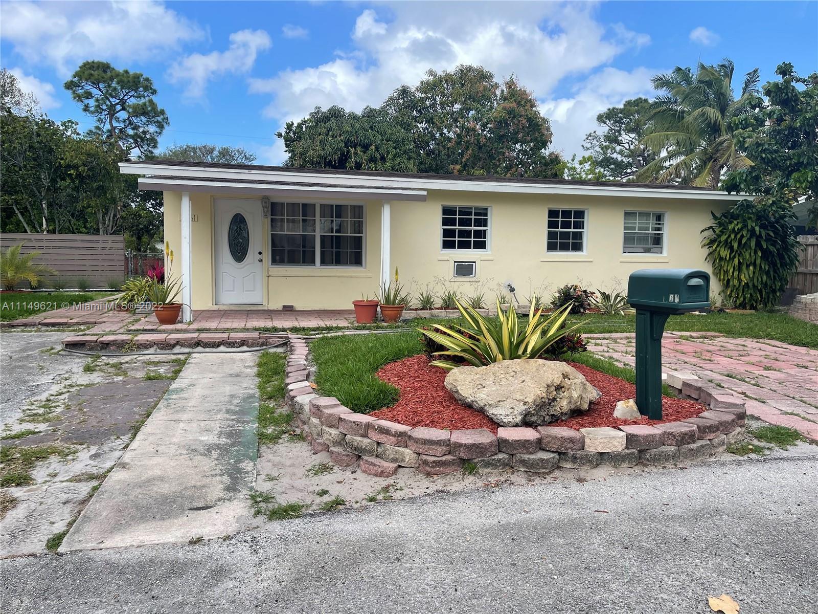 Charming 3/2 with oversized lot of 9,000 Sft. Don’t miss this opportunity to build additional equity with your own touch of upgrades & TLC with a pool, a deck or a gazebo to this spacious backyard. Ideal life style and amazing starter home for a young professional family with space to grow. As-is with no comparable upside market value  in this small quiet community. Grab your own little slice of heaven  a canine lover’s dream. With some remodeling already on the way, property features a beautifully stylish vaulted ceiling & Grove style landscape & Driveway potentials. This home is just minutes from the Hard Rock Casino or Hard Rock Stadium, home of the FL Dolphins. Property is located 8 minutes from downtown FLL, 12 minutes from FLL International Airport, and 3 to 5 minutes from I 95, &595