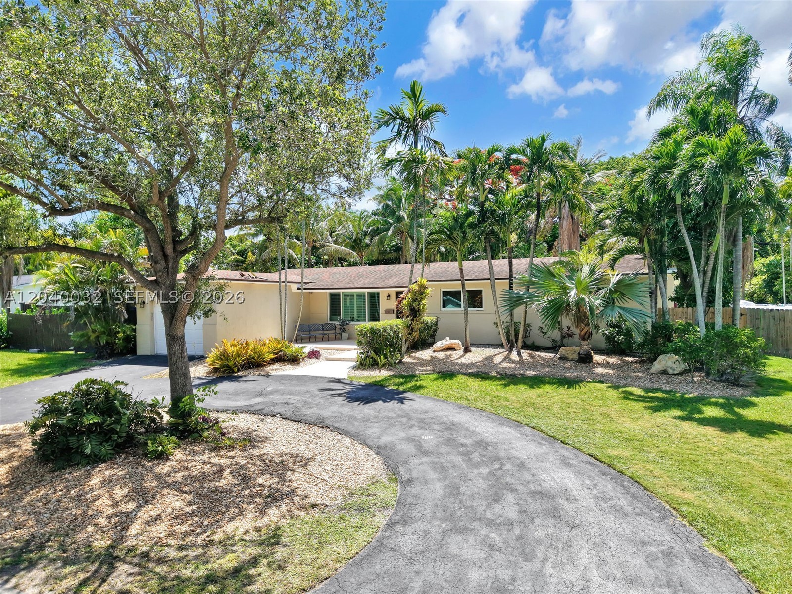 Discover a rare opportunity to own a private tropical oasis in one of Miami's most desirable locations. Nestled on a spacious corner lot surrounded by mature palms and lush landscaping, this property offers an exceptional blend of privacy, outdoor living, and future potential.
A circular driveway provides impressive curb appeal and abundant parking. Inside, bright, inviting living spaces are filled with natural light, complemented by a functional layout and newly installed modern flooring. The home has been enhanced with impact-resistant doors and windows for maximum security, energy efficiency, and peace of mind. Generously sized rooms offer flexibility for family living, guest accommodations, or a home office.
The backyard is the crown jewel of this estate. Designed for year-round enjoyment, it features a large swimming pool, expansive patio areas, and beautifully landscaped grounds perfect for entertaining or relaxing in complete privacy. The oversized yard also provides plenty of room for future enhancements. Additionally, the spacious primary bathroom boasts quality finishes and a large walk-in shower for a spa-like feel.
Ideally located near major highways, shopping, dining, parks, and schools, this property combines everyday convenience with the serenity of a private retreat. Whether you are seeking a primary residence, a vacation home, or an investment opportunity, properties offering this level of land, privacy, and outdoor living rarely come to market.