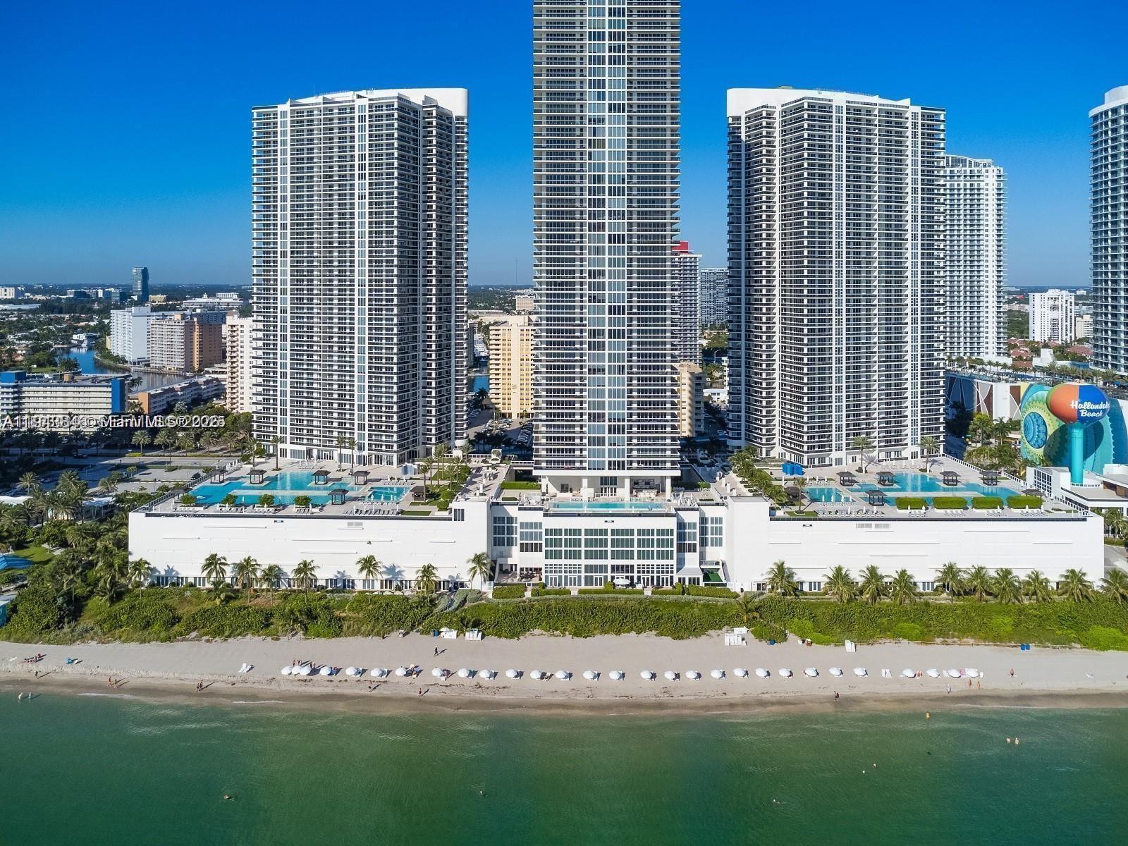 Stunning 2 bedrooms 2 baths corner unit with panoramic ocean and intracoastal views. This luxury residence located in the prestigious Hallandale Beach Club features European Style kitchen cabinets gorgeous granite counter tops, NE views, huge wrap-around balcony and marble floor throughout. Fully furnished and equipped. King bed in master bedroom and twin beds in second bedroom. Five Star Resort Style Amenities such as two stories exercise room overlooking the ocean, spa, sauna, steam room, 5 heated pools, bar with pool service, 24 h concierge and valet parking, beach service and more. Prime location close to the FLL airport, Bal Harbor and Aventura mall. AVAILABLE NOW , 2026.