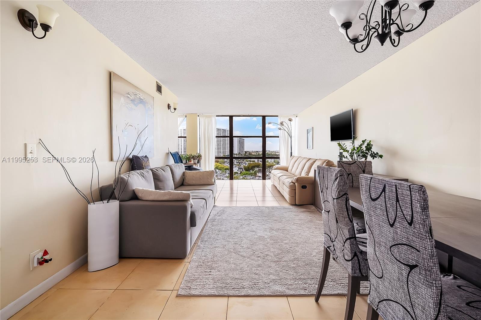 Very bright & spacious 1bed/1,5 bath apartment nestled within the secure confines of the Three Islands community, just a few blocks away from Hallandale Beach, Walmart, and Diplomat Country Club, Oceanview Park. This generously spacious residence features a sizable living room and bedroom. With a large kitchen, walk-in closets, and a separate dining area that could also function as a den due to the expansive living room, this unit offers ample living space. Enjoy breathtaking sunset views through the ceiling-to-floor windows, all facing west. The building boasts amenities such as tennis courts, a pool, BBQ areas, a state-of-the-art gym, picnic spots, concierge services, 24/7 security, a laundry room on each floor, and secure fob entry throughout the premises.