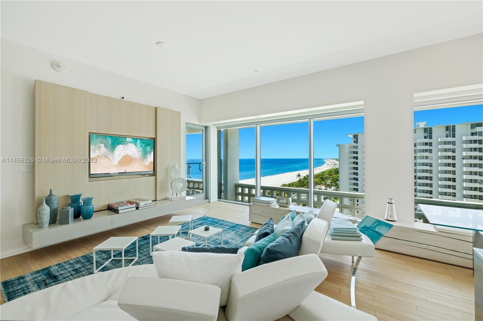 Experience luxury living at its finest in this impeccably upgraded two bedroom residence at The Edition.  Every detail of this unit has been carefully curated by Alessandro Isola: the unit features a bespoke use of high quality white leather and brushed white stained oak,   seamlessly blending style and comfort. The predominantly white space is infused by a sea color palette, creating a calm and pure environment. Every piece of furniture and decor has been carefully selected and custom crafted to complement the residence’s design aesthetic. Residents at The Edition enjoy access to a host of world-class amenities, and with its prime location in one of the most coveted beachfront properties.