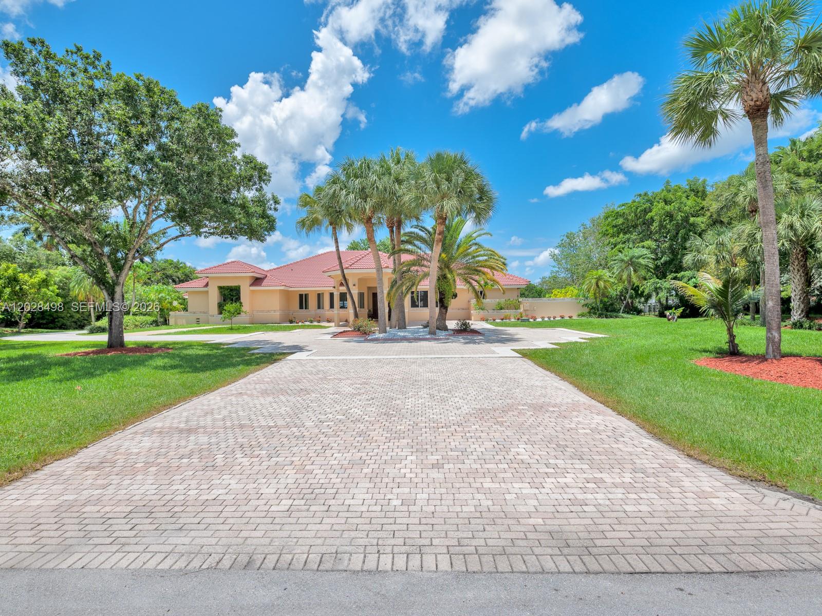 REBUILT IN 2014 WITH NEW IMPACT WINDOWS, TRUSSES, ELECTRICAL, PLUMBING, AND A/C. THIS HOME IS SITUATED ON 1.67 ACRES IN PRESTIGIOUS WINDMILL RANCH ESTATES WITH THE MOST STUNNING LAKE VIEW. FEATURES 7 BEDROOMS 5 BATHS, GRANITE KITCHEN COUNTER TOP, STAINLESS STEEL APPLIANCES, MARBLE TILE FLOOR, RECESS LIGHTS, FRUIT TREES AND DRIVEWAY TO ACCOMMODATE APPROXIMATELY 10 CARS. SPRINKLER.ALL PERMITS ATTACHEDBedrooms:7 Bathrooms:5 Interior Features: First Floor Entry, Closet Cabinetry, Dome Kitchen, Entrance Foyer, French Doors, Laundry Tub, Pantry, Attic, Den/Library/Office, Family Room, Florida Room, Great Room, Utility/Laundry In Garage, Utility Room/LaundryElectric Description:Circuit Breakers Water Source:Laked Drain Sewer:Public Sewer Laundry Features:Laundry Tub, In Garage, Utility Room.