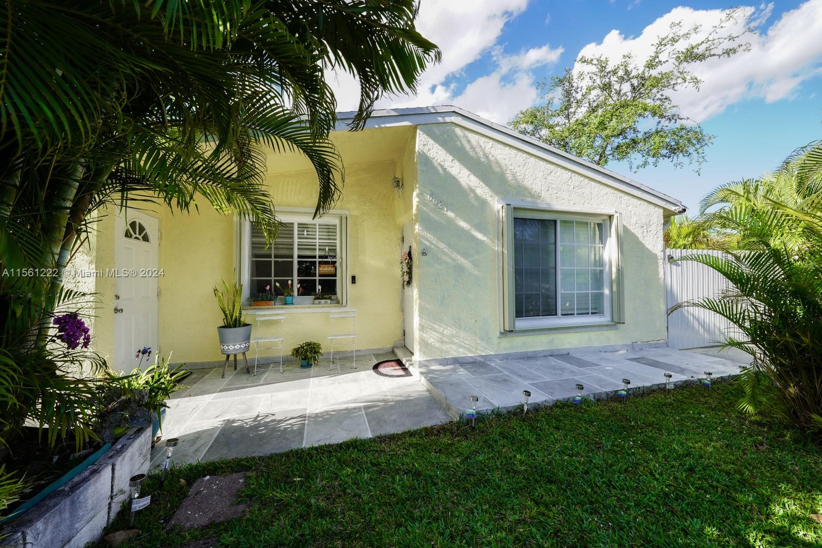 You must come out and see this charming gem of a home that has been meticulously maintained and remodeled by long-term owner.  Its unique layout may be perfect for your family to live affordably.  In addition it has NO homeowner association fees, a recently installed 2019 Roof, upgraded plumbing and electrical and accordion shutters will make a big difference in monthly affordability when factoring in today's insurance rates.  It is also NOT in flood zone, which will further help you save.  It's beautiful landscaping is testament to the care this homeowner has had with the home.  Nicely painted and no popcorn ceilings.  Enjoy entertaining friends in the large backyard covered terrace.  Plenty of parking for guests!  Enjoy fruit trees of mango, guanabana, avocado, and niparo.