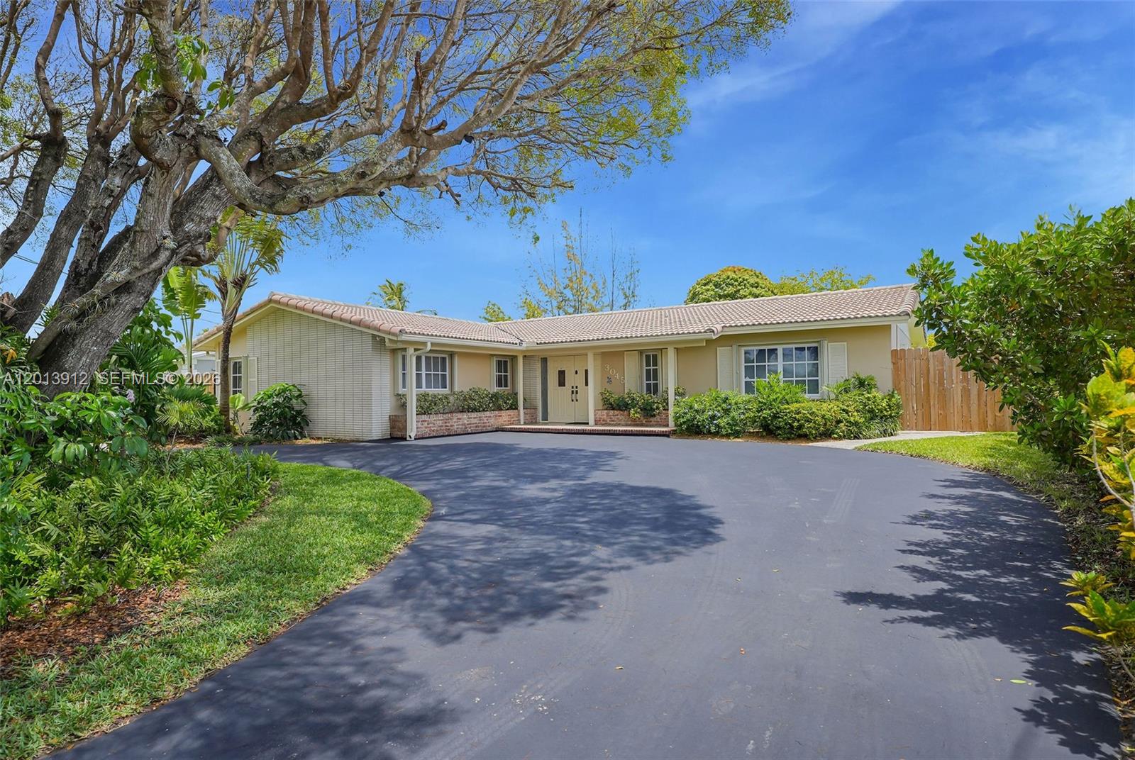 Beautifully updated 5bed/2bath canal-front home with water access, an oversized lot, and large driveway. Features include a fully updated kitchen, newly remodeled bathrooms, brand new flooring throughout, and recessed lighting. This home offers spacious living areas with an abundance of natural light, in-house laundry, and room for a boat and pool. The converted garage offers a private entrance for guests or in-laws, while the detached structure provides endless potential. Located on a quiet low traffic street this private oasis offers a combination of sophisticated indoor and outdoor living. Located less than 5 minutes from a major hospital and the Florida Turnpike, with easy access to shopping, and dining.