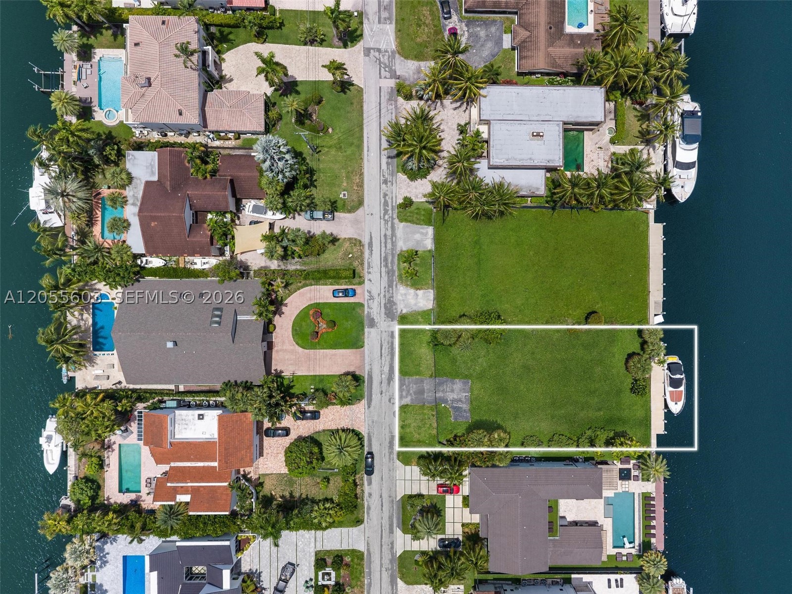 Rare opportunity to build your dream home on this large 12,751-square-foot waterfront lot, tucked within a sought-after gated community. Set on a scenic canal with 85 feet of deep water access, this parcel is a boater’s dream complete with a brand-new seawall and brand-new dock, ready for your yacht or center console. Design a custom residence that captures serene water views and embraces true South Florida indoor-outdoor living. Just minutes from the beach, top dining, shopping, and major roadways, this is your chance to create a waterfront retreat from the ground up.