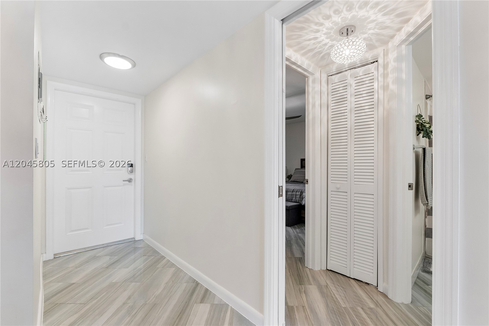 This 2 bed 2 full bath condo completely remodeled. Updates included the AC, HWH, electrical, flooring, new kitchen, bathrooms, appliances, and paint. The second bedroom has its own private entrance and a full bathroom located off a hallway that can be locked for complete separation from the rest of the home. The main living space opens to a private, screened-in patio. The community features guard-gated security, an on-site restaurant and bar, a clubhouse, a pool, and a fully functional gym. The community also has good reserves and no known assessments, making it a great choice for anyone including a first time buyer or FHA / VA.  This is a cat only building