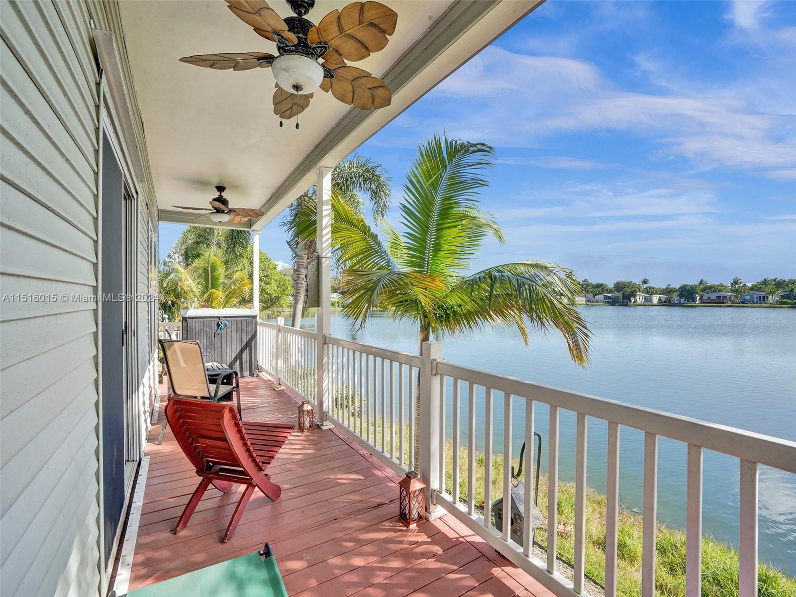 Exciting opportunity to view the largest waterfront home in Lauder Lakes a 55+ community. This 3/2 gem boasts spacious rooms, a large porch for sun-soaked afternoons, stainless steel kitchen appliances, dark wood cabinets, and a large island with a sit-at bar. Meticulously designed with crown molding, upgraded ceiling fans, recessed lighting, and laminate flooring. The home features large bathrooms, a spacious laundry room with a sink, and ample parking on a stamped concrete pathway. The community offers a clubhouse with a kitchen, pool table, outdoor pool, sauna, whirlpool, shuffleboard. Only minutes away for FLL Airport and the Beaches Don't miss out on this extraordinary manufactured home. OWNER MOTIVATED, LANS IS LEASED 1250 PM