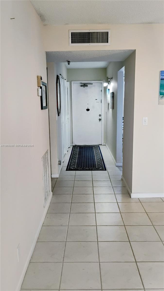 PRICE DECREASE 
OWNER MOTIVATED "Escape to your personal oasis in this stunning 925 sq. ft. penthouse, where mesmerizing lake views and golden sunsets become your daily backdrop. This meticulously maintained 1-bedroom, 2-bath residence is designed for both serene relaxation and effortless hosting, featuring an additional Florida room that bathes the home in natural light.
Enjoy modern convenience with a like-new washer/dryer, updated water heater, and the peace of mind provided by accordion shutters. The thoughtful layout includes ceramic tile throughout the living areas, an assigned parking spot just steps from your door, and ample storage for all your seasonal needs.
Beyond your private retreat, indulge in a resort-style lifestyle with access to a vibrant clubhouse, fitness center, and a sparkling pool with shaded cabanas. Whether as a full-time residence or a seasonal escape, this is penthouse living at its finest."