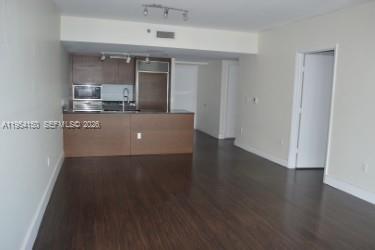Spectacular and Cozy apartment 1 bedroom and 1 bath, located on the Icon tower 1 luxury residential complex. Kitchen with high-end appliances, including an oven, dishwasher, refrigerator, microwave, washer and dryer, central air conditioning, and garbage disposal. Laminate wood flooring. Located on the 18 th floor with amazing views of the Miami River entrance and Brickell Bay. The unit has one parking space assigned. The Icon boasts world-class amenities,  the largest swimming pool in the US, one state-of-the-art fitness center & spa, public and private parks, a world-class restaurant, and more.