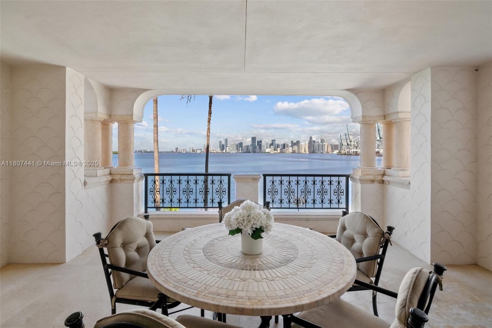 Charming pied-à-mer, this spacious 2BR/2.5BA offers the comfort of a luxurious yet relaxed home away from home. Features marble floors, cozy living areas, a sprawling master suite with double door entry, and a breakfast room. The second bedroom/guest suite includes a private entrance. Entertain on the deep, wide terrace with stunning views of the Miami skyline and sunsets. Private gated courtyard entry adds to the charm and exclusivity.