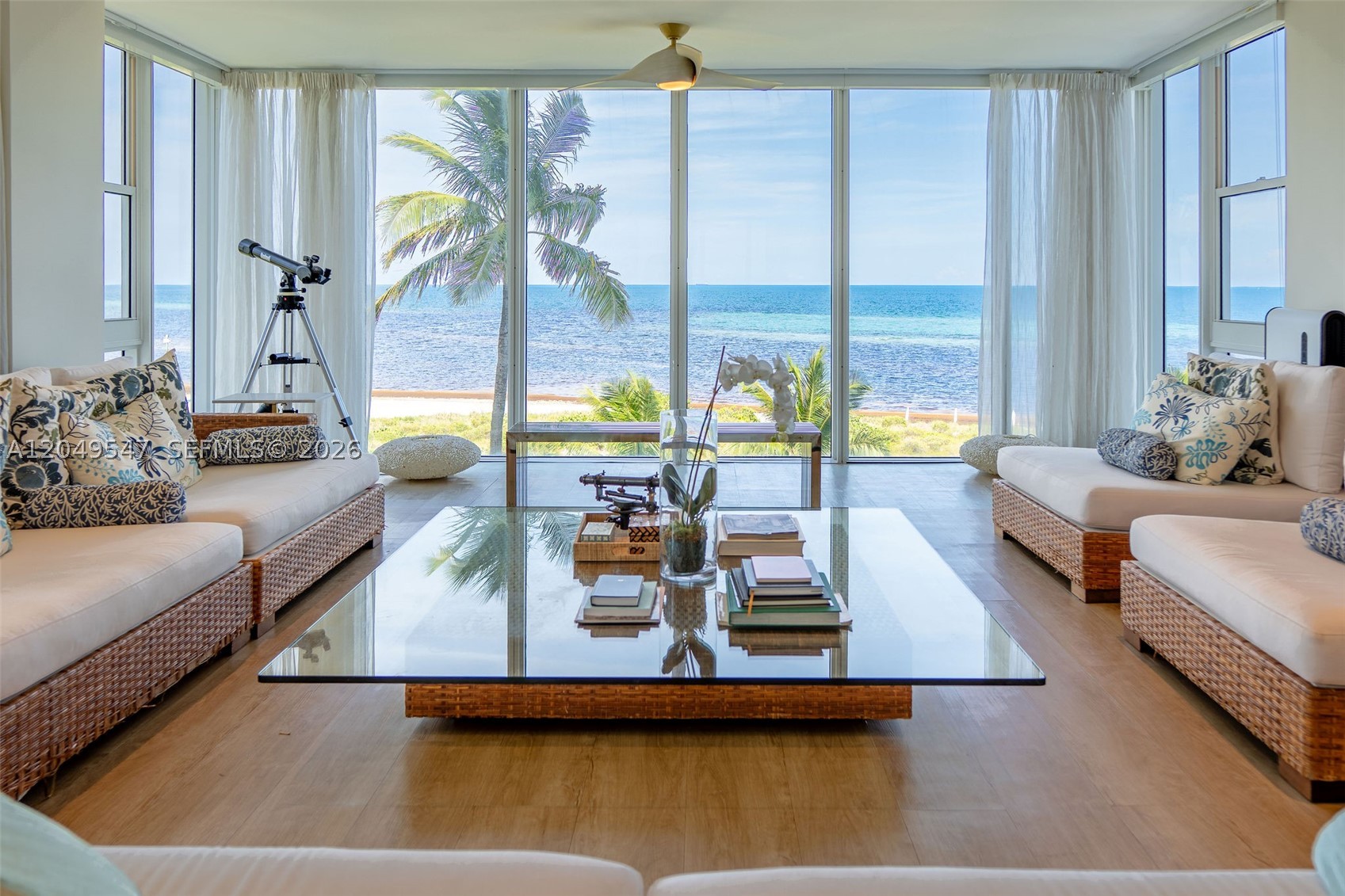 Wake up to the sound of the waves and endless horizon views in this breathtaking direct oceanfront Key Biscayne sanctuary. Located in the highly sought-after Island House, this rare 3-bedroom-plus-den, 4-bath home spans nearly 2,400 square feet of seamless, open-concept design. Every room is kissed by natural light, with floor-to-ceiling windows that serve as a living canvas of the Atlantic. Pour a glass of wine and step onto your private balcony to watch the sunset, or take the elevator directly down to your quiet, pristine beach. Complete with a heated oceanfront pool, fitness center, elegant secure lobby, and covered parking, this is more than a home — it is a daily vacation.