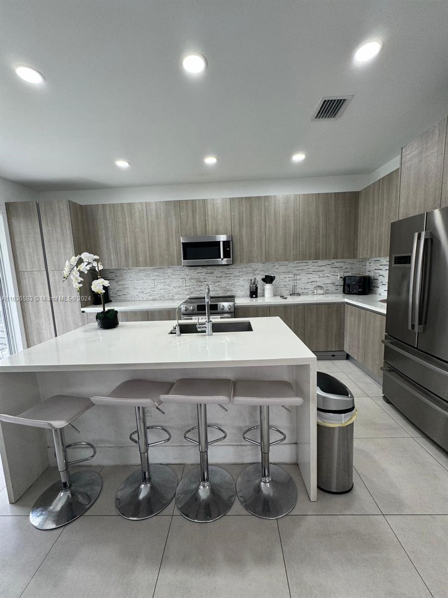 **Priced to be Sold** Beautiful Townhouse located on Neovita, with 3 bedrooms and 2 and half bathrooms. Modern design. Incredible location within walking distance to CVS, TJMAX, Banks, Publix, restaurants, charter schools