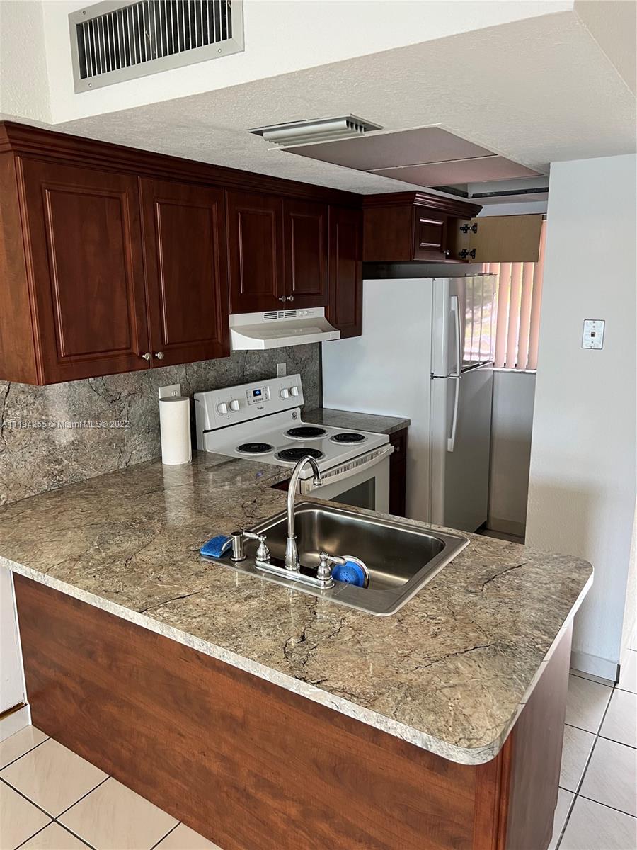 Bright and cozy lake front apartment in West Hialeah. Enjoy the Sunset on the Lake view from the balcony and living room. Property features 2 bedrooms/ 1 full shared bath upstairs and a convenient half bathroom downstairs. Washer and Dryer inside the unit, 2 parking spaces assigned. Don't miss the opportunity to lease this beautiful unit and deal with an exceptional landlord. VACANT and READY for IMMEDIATE  OCCUPANCY. EASY TO SHOW