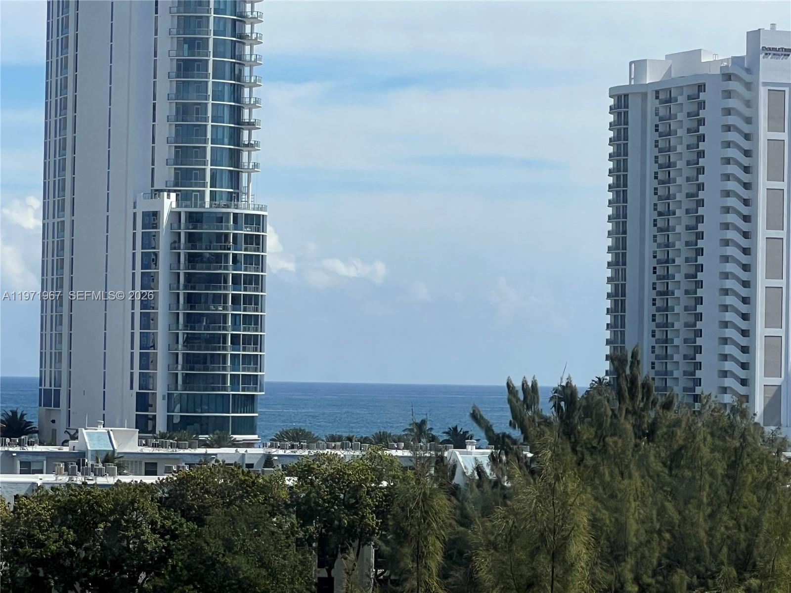 Spacious 2/2 Plus a Versatile Den *** Wide Floor to Ceiling windows and Doors *** Facing East with a Beautiful view of the Ocean and Park  from All Rooms ***  Abundance of Natural Light Throughout the Whole Unit ***  Walking Distance to Gorgeous Beaches ***Basic Cable and Internet Included in the Maintenance Fee *** Low Maintenance Fee *** Hurricane Shutters *** Ok to Rent First Year *** Look No Further *** This is IT !!!! " 40 Years Certification in Progress"