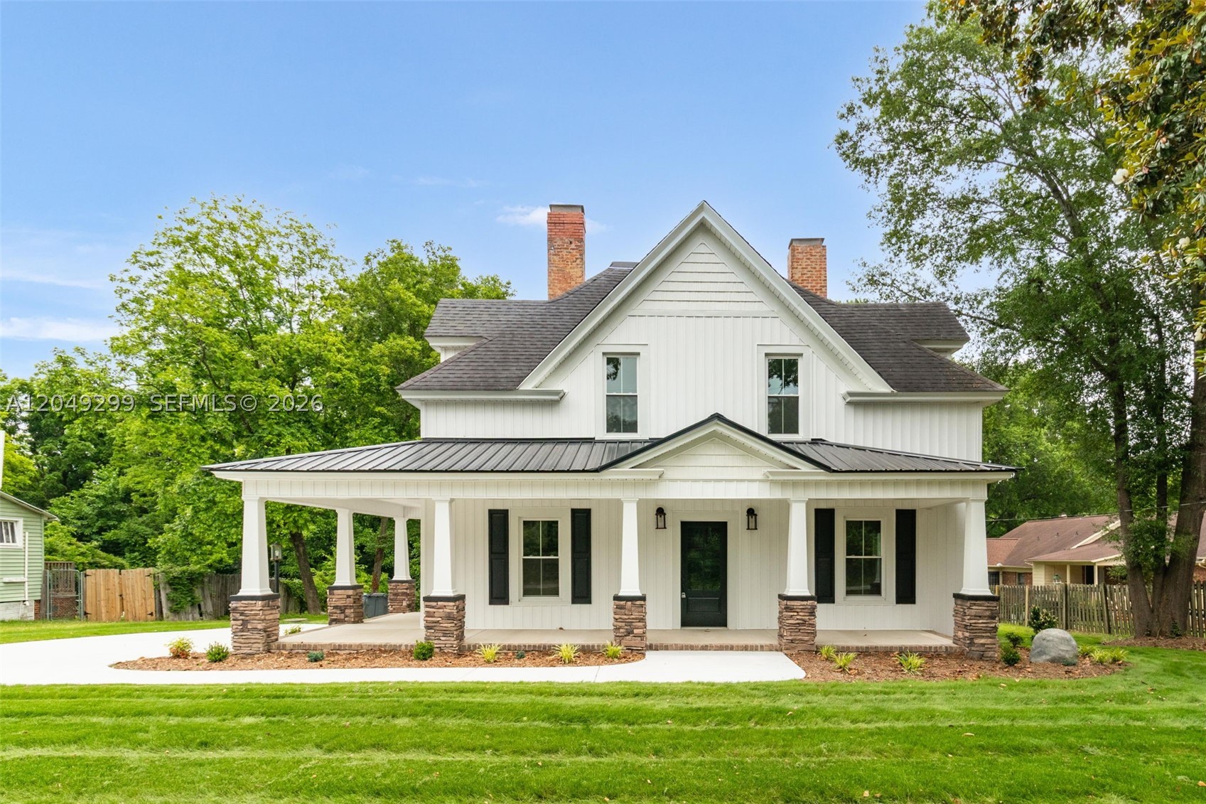 Timeless architecture and modern day craftsmanship converge in this unique 4 bed 2.5 bath property that has been updated with today's amenities while preserving its character. The entry boasts original wood ceilings, crown molding and hardwood floors. This look is carried throughout and is extremely evident in the living room which boasts an original fireplace w/ gas a logs, and a mantle crafted from original moldings. Through the study is a dining room complete w/ trey ceiling, chandelier, and built ins. The large kitchen features shaker cabinets, quartz countertops, and subway tile backsplash. The main floor also consists of a moody half bath, convenient full bath and bedroom. Up the original staircase are 3 well appointed bedrooms and the ensuite w/ a double vanity, tub, large tile shower, and a massive walk in closet. Outside living space is immense, featuring a wrap around porch, back deck, and side balcony. Schedule your showing today!