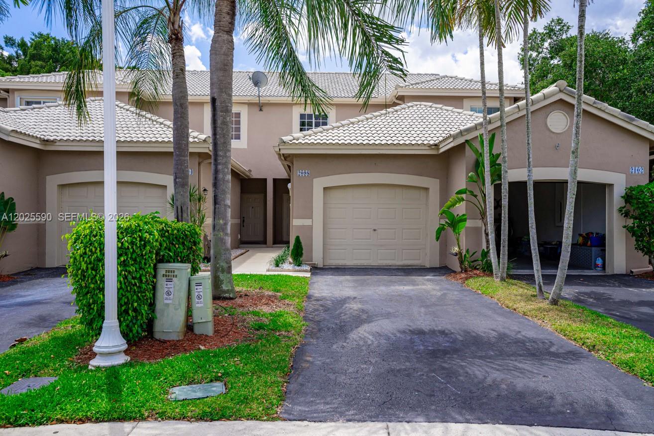 Beautifully Remodeled 2BR/2.5BA AVAILBLE TO RENT ON AUGUST 1st. Townhouse with 1-Car Garage in Weston. This completely renovated unit has been upgraded from top to bottom and features a freshly painted interior, new modern vinyl flooring, updated lighting, new blinds, and new toilets throughout. Brand-new white shaker cabinets, stunning Calacatta marble-style quartz countertops, and stainless-steel appliances. Dual Master Suites: Upstairs features two spacious master bedrooms, each equipped with its own walk-in closet and fully renovated en-suite bath with brand-new vanities. Living & Outdoor Space: A convenient half-bath is located downstairs. Enjoy a private, screened-in back patio with a lush garden view and no rear neighbors—perfect for a BBQ grill and patio set. Central A/C is less than 2 years old. The 1-car garage includes extra built-in storage cabinets.Strictly No Pets Allowed.