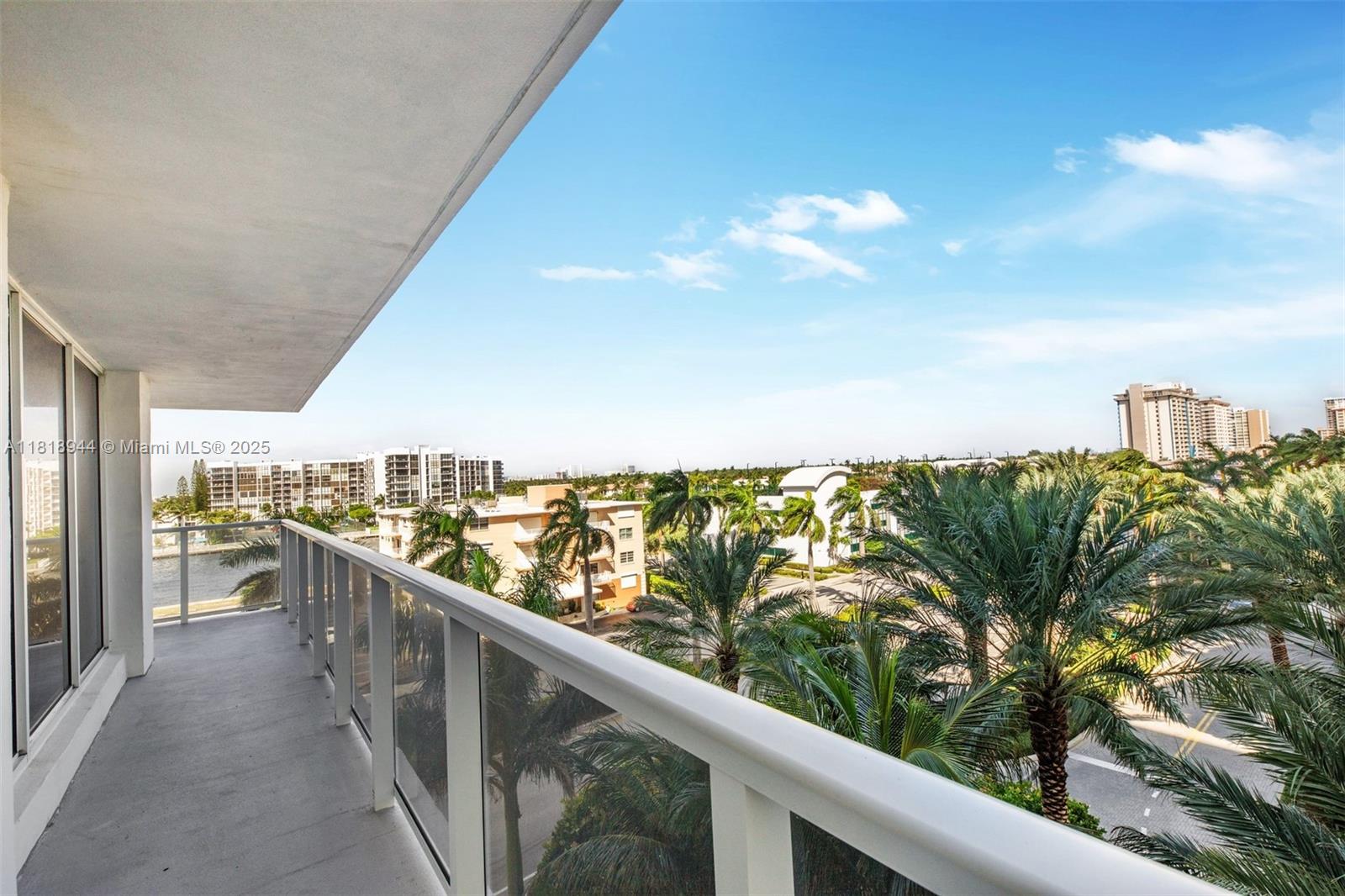 Experience beachfront living in this mid- floor corner residence with sweeping west-facing city and intracoastal views. Floor-to-ceiling windows fill the living area with natural light, while the wrap-around balcony creates true indoor-outdoor living for sunset entertaining. Thoughtfully laid out with in-unit washer and dryer and generous living space throughout. Enjoy a full-service oceanfront building offering a fitness center, two pools, on-site restaurant, valet and full beach service.
