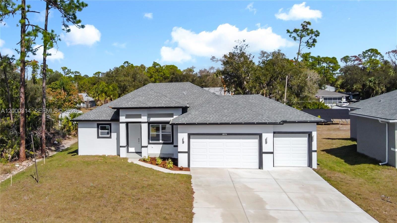 SELLER IS MOTIVATED AND WILL CONTRIBUTE TOWARD THE BUYER’S CLOSING COSTS. WELCOME TO THIS BEAUTIFULLY DESIGNED MODERN HOME. This 4-bedroom, 2.5-bath residence offers 1,695 sq. ft. of well-planned living space with an open-concept layout and contemporary finishes throughout. The kitchen features a striking quartz waterfall island and clean, modern cabinetry, ideal for both everyday living and entertaining. The living area is highlighted by an electric fireplace, adding warmth and character to the space. THE PRIMARY SUITE SERVES AS A PRIVATE RETREAT, complete with a spa-inspired bathroom featuring a freestanding tub, dual sinks, and elegant marble-style tile. Covered lanai, A SPACIOUS 3-CAR GARAGE offers approximately 721 sq. ft., ideal for vehicles, storage, or a workshop. With a total construction area of 2,625 sq. ft., this home blends comfort, functionality, and modern design. Additional features include a smart key system for added security and a 2-10 Home Buyers​​‌​​​​‌​‌​​​‌‌​​​‌‌‌​​‌​​‌‌​​​​ Warranty.