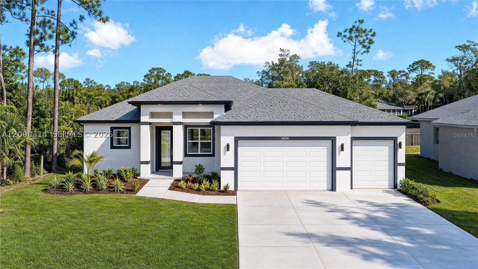 SELLER IS MOTIVATED AND WILL CONTRIBUTE TOWARD THE BUYER’S CLOSING COSTS. WELCOME TO THIS BEAUTIFULLY DESIGNED MODERN HOME. This 4-bedroom, 2.5-bath residence offers 1,695 sq. ft. of well-planned living space with an open-concept layout and contemporary finishes throughout. The kitchen features a striking quartz waterfall island and clean, modern cabinetry, ideal for both everyday living and entertaining. The living area is highlighted by an electric fireplace, adding warmth and character to the space. THE PRIMARY SUITE SERVES AS A PRIVATE RETREAT, complete with a spa-inspired bathroom featuring a freestanding tub, dual sinks, and elegant marble-style tile. Covered lanai, A SPACIOUS 3-CAR GARAGE offers approximately 721 sq. ft., ideal for vehicles, storage, or a workshop. With a total construction area of 2,625 sq. ft., this home blends comfort, functionality, and modern design. Additional features include a smart key system for added security and a 2-10 Home Buyers​​‌​​​​‌​‌​​​‌‌​​​‌‌‌​​‌​​‌‌​​​​ Warranty.