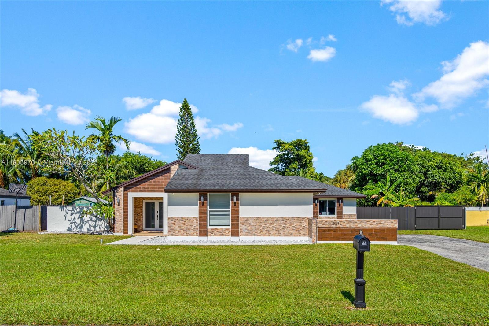 No HOA! This ideally located Miami home with a modern open layout and custom kitchen is waiting for you. The versatile floor plan is ideal for multi-generational living. An extra family room with full bath can easily become a 4th bedroom, ensuite or studio. Income potential by converting the garage to a large efficiency or in-law quarters. Expansive yard with fruit trees, room for a pool, RV & boat parking, and still plenty of outdoor space to enjoy.  Situated in a desirable, well-loved neighborhood near parks and everyday conveniences.
