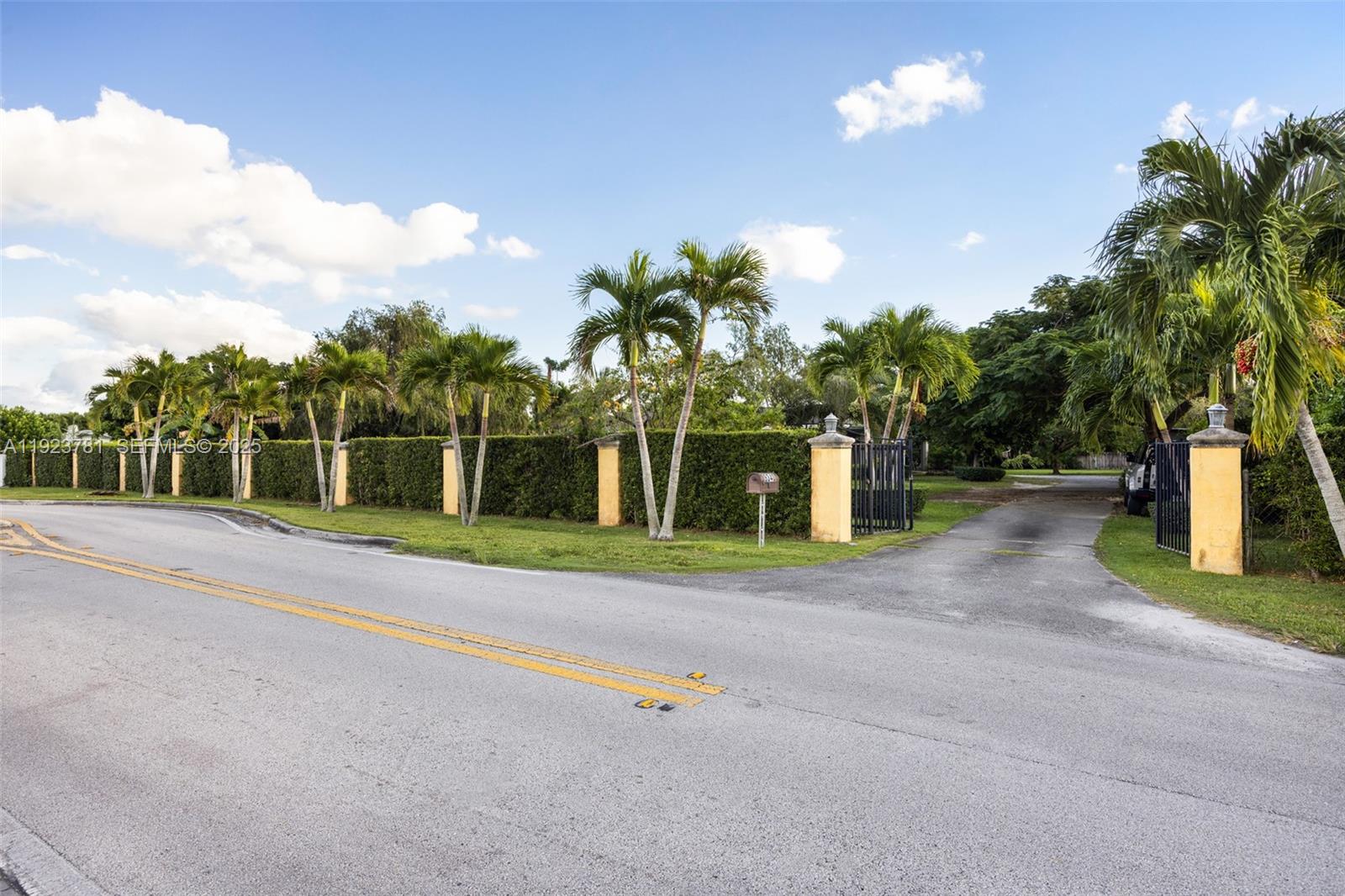 Set on a rare 1-acre lot in Palmetto Bay, this charming mid-century home offers serene, suburban living just moments from top dining and major thoroughfares. Built in 1956, the 3-bedroom, 2-bath residence features timeless terrazzo floors, a bright split-bedroom layout, and central A/C. The spacious yard invites endless possibilities with room to expand, add a pool, or create your ideal outdoor retreat. Additional highlights include a utility room, carport, hurricane shutters, and mature fruit trees. A rare opportunity in a coveted location.