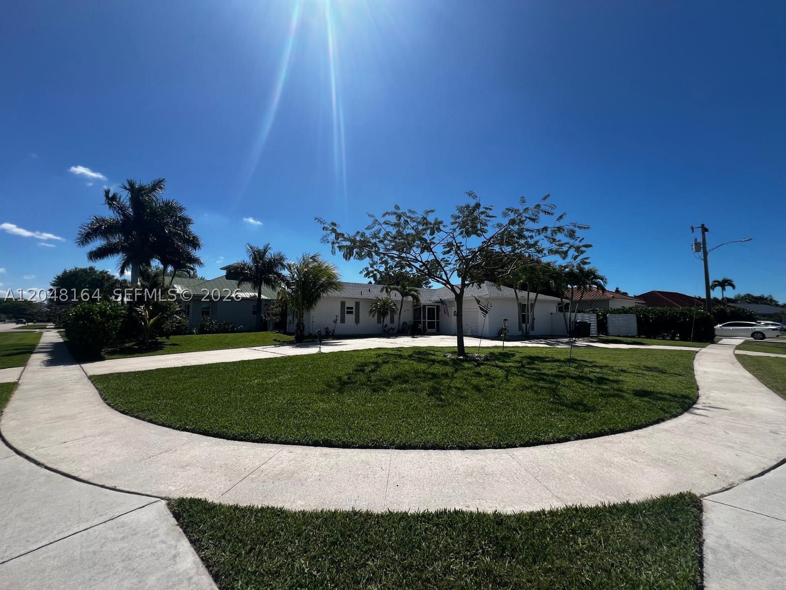Your Gain, Seller's lost.  Hurry, Hurry to make an appointment to view this excellent well maintained exclusive Marco Island POOL corner Home, with expansive open concept living area with high ceilings, filled with natural light for both everyday confort and enternainment. Large circular driveway. Updates include IMPACT WINDOWS, kitchen, roof, water heater , kitchen flooring, and master bath. Located less than a mile to Marco Island Florida Beaches, fine dining, shopping, and just 40 minutes from Naples Airpor. Check your comps and you will find out that the price is right. Call listing agent for showing instructions and for more details. Garage has been converted making this property more desirable. Property is larger than tax rol  close to schools, and across the street from the golf course.