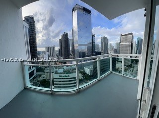 Exceptional high-floor living awaits at The Plaza on Brickell. Perched on the 28th floor, this immaculate one-bedroom, one-bathroom residence boasts captivating, panoramic city views. The thoughtfully designed interior features an elegant Italian-style kitchen complete with premium wood cabinetry, granite countertops, stainless-steel appliances, and a convenient in-unit washer and dryer. Residents enjoy access to an unparalleled array of resort-style amenities, including a pristine pool deck with a jacuzzi, a state-of-the-art fitness center, a dynamic game room, a business center, a private theater, valet parking, and 24-hour attended lobby security. Perfectly positioned in the vibrant heart of Brickell, this sophisticated urban retreat places you just steps away from world-class dining, upscale shopping, and premier entertainment destinations.