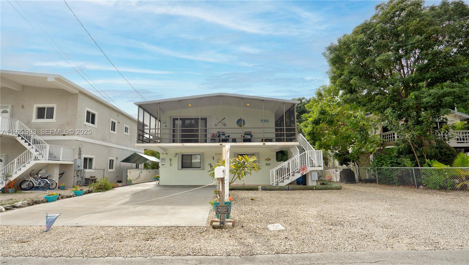 Solid Concrete Home - Steps from Harry Harris Park!
This beautifully updated 4Bedroom/2Bathroom concrete home with a concrete roof offers everything you've been looking for. Upstairs features 2 bedrooms and 1 bath with a wraparound screened porch, while downstairs provides another 2/1 with its own screened patio — ideal for guests or family. 

The chef's kitchen boasts quartz countertops, new appliances, and plenty of space to entertain. Impact windows and doors, upgraded tile floors, and abundant natural light make every room feel inviting. Spacious closets and thoughtful extras throughout add comfort and convenience. 

Located in Tavernier near Harry Harris Park, the beach, boat ramp, hospital, schools, shopping, and restaurants, this home combines durability, style, and unbeatable access to the Keys lifestyle. 
Make your appointment today!!!