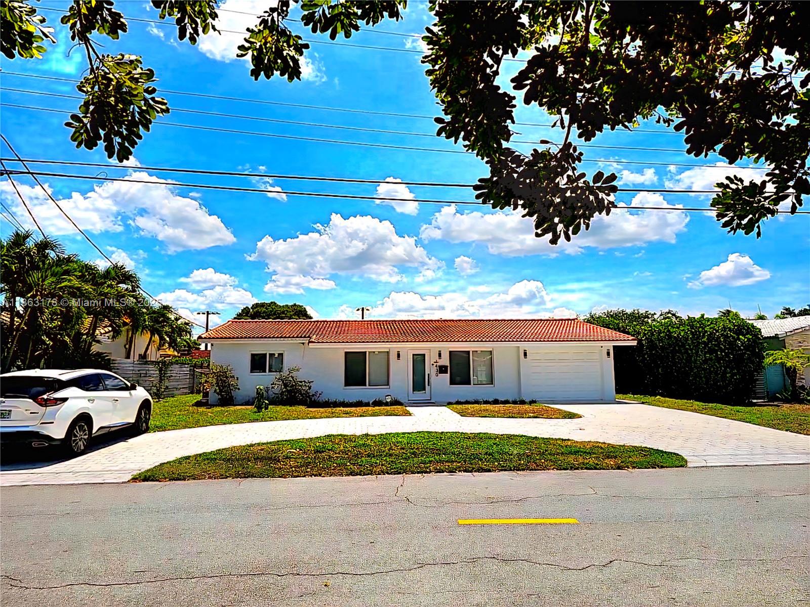 OCCEAN ACCESS FIXED BRIDGES. NEW IN 2024 IMPACT WINDOWS A/C AND POOL HEATER, one car garage. Amazing and sought out CORAL RIDGE ISLES community. 78 FEET of WATERFRONT property. Circular driveway with plenty of parking. 3 BEDROOMS AND 2 AND A HALF BATH. Large Florida room for extra living space. Big covered porch with amazing view of the pool and water. Private dock.