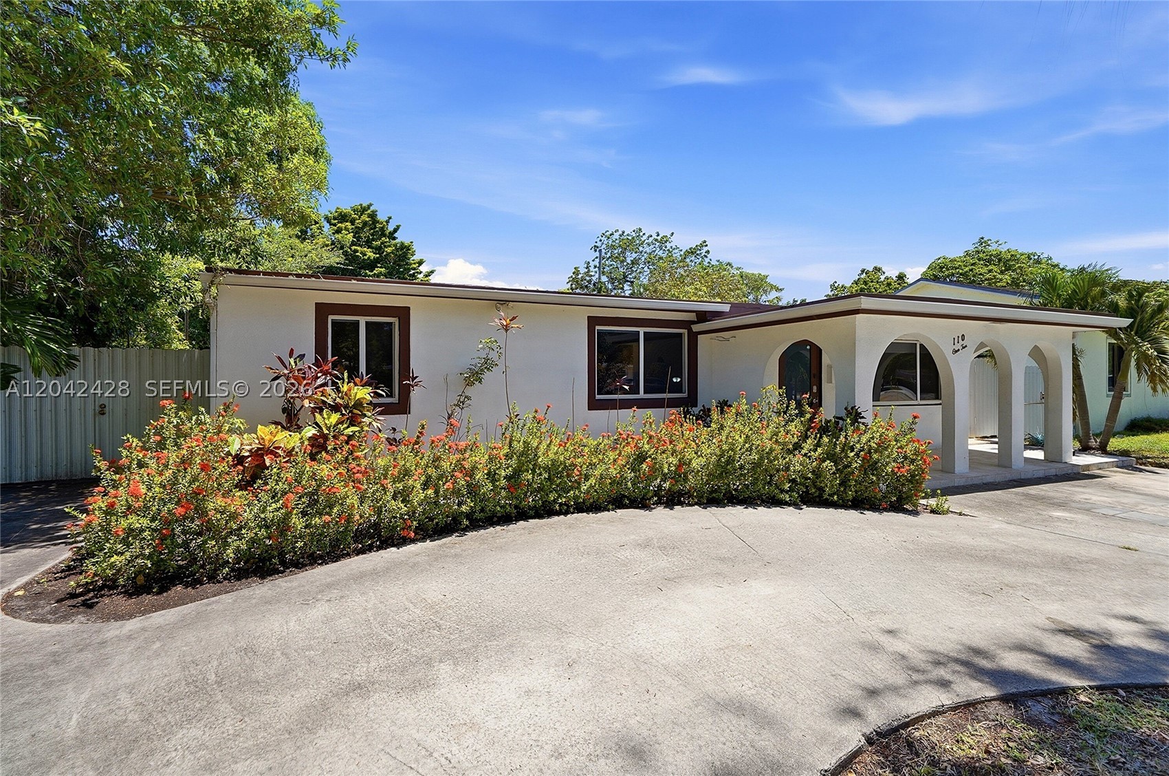 Absolutely stunning pool home situated on a beautifully landscaped lot in an exceptionally convenient location, this elegant residence combines timeless charm with modern updates. Sparkling porcelain floors, a welcoming semi-circular driveway, and majestic mature oak trees create a striking first impression. Ideally positioned just minutes from posh Miami Shores, Miami Beach, Bal Harbour, and Bay Harbor Islands, with effortless access to 95, the home delivers both tranquility and connectivity. The wonderfully private backyard retreat is designed for year-round enjoyment, featuring premium synthetic turf that surrounds a sprawling resort-style pool, creating the perfect setting for relaxation, entertaining, and outdoor living. Inside, the thoughtfully updated floor plan offers four spacious bedrooms, two beautifully appointed baths, and a versatile den, ideal for a home office, playroom, or additional living space. Recent improvements include a new roof from 2021 and mostly impact windows and doors. The chef-inspired kitchen showcases granite countertops, stainless steel appliances and abundant workspace, seamlessly connecting to the home’s living and entertaining areas. With an exceptional layout and a beautifully fenced yard, this move-in-ready residence delivers comfort, style, and generational value in one of the area’s most desirable and centrally located neighborhoods.