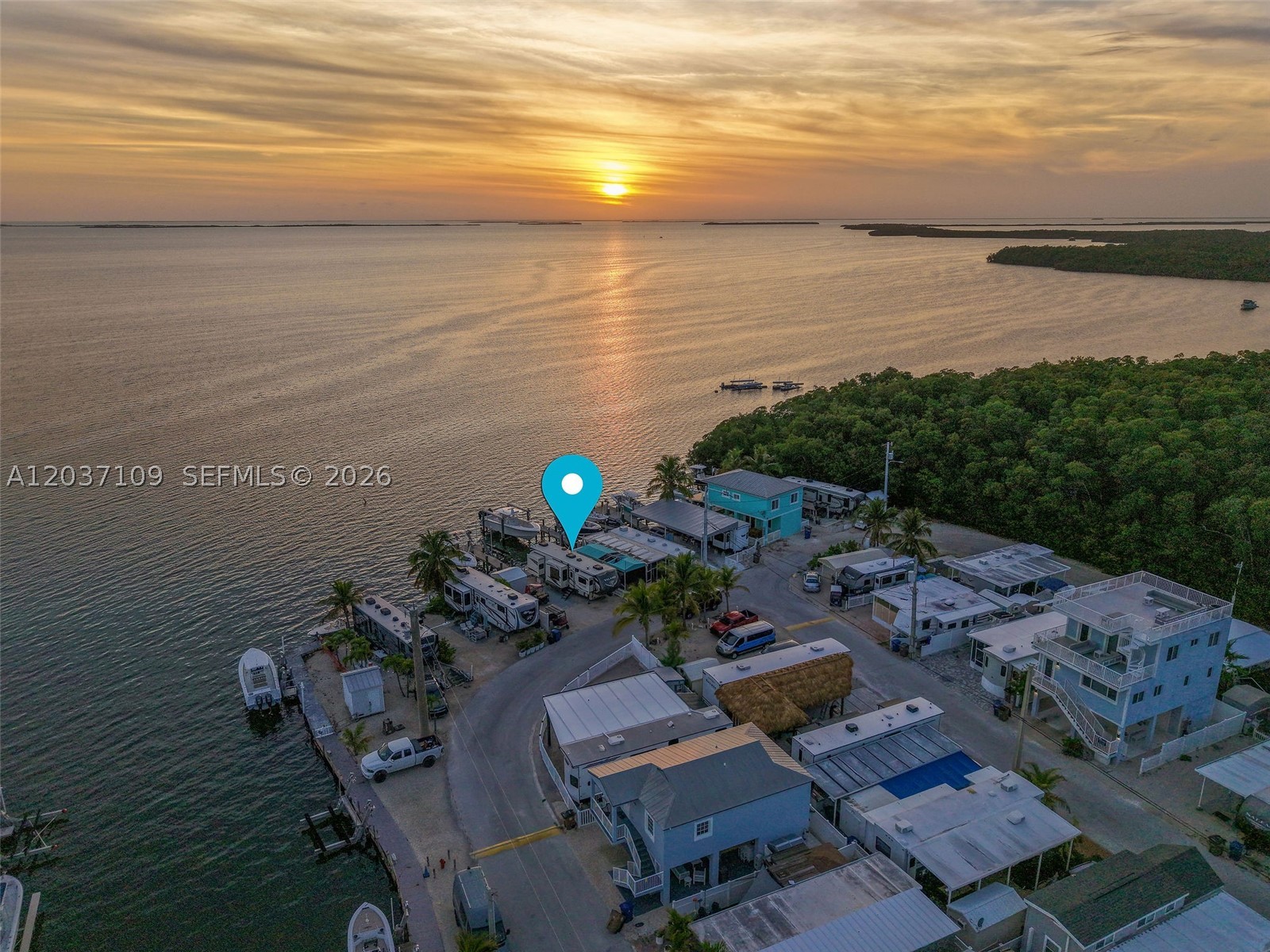 Discover an exceptional waterfront opportunity in the heart of Key Largo! This oversized 35' × 50' bayfront lot features 35 feet of private dockage, two boat lifts, and breathtaking sunset views over the bay.
Perfect for RV enthusiasts, boaters, and those looking to build their dream getaway in the Florida Keys, this versatile property also offers the opportunity to build a house, creating your own custom waterfront retreat.
Conveniently located near world-class fishing, marinas, restaurants,and local attractions, with easy access to the mainland in approximately 45 minutes. Enjoy a welcoming community with outstanding amenities, including a boat ramp, swimming pool, clubhouse, basketball and tennis courts.
Whether you're seeking a vacation retreat, investment opportunity, RV destination, or future waterfront home site, this unique property offers the ultimate Keys lifestyle.