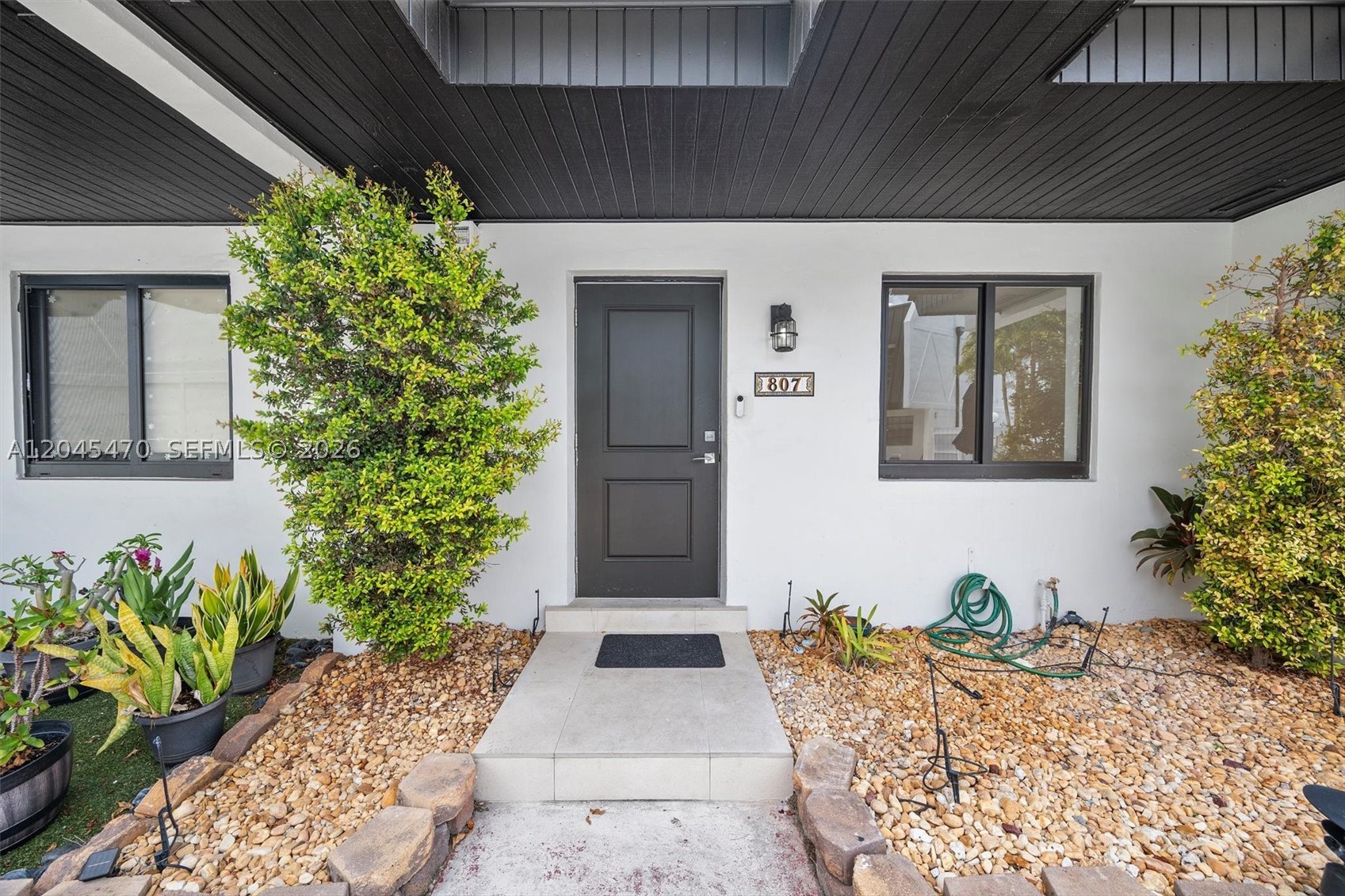 Just fully renovated and ready for its new owners, this two-story Miller Drive townhome was completely redesigned with a modern, minimalist aesthetic. No expense was spared in this remodel!

The main floor features a bright, wide-open layout anchored by large tile floors and a custom glass staircase. The kitchen is built to entertain, highlighted by a massive waterfall island, sleek cabinetry, and stainless steel appliances. Upgrades include all-new kitchen appliances, washer and dryer, new AC and ductwork, impact windows and doors, and LED recessed lighting throughout.

Upstairs, the clean design continues with spacious bedrooms and fully updated bathrooms featuring glass shower enclosures and modern vanities. The home also includes in-unit laundry, two assigned parking spaces, and a community pool just steps from the front door.

Centrally located with fast access to Coral Gables, South Miami, the University of Miami, and Tropical Park. This is a rare, completely turn-key property.

*UPDATE 7/3: Multiple offers above asking! Submit highest & best. Agents, read broker remarks.