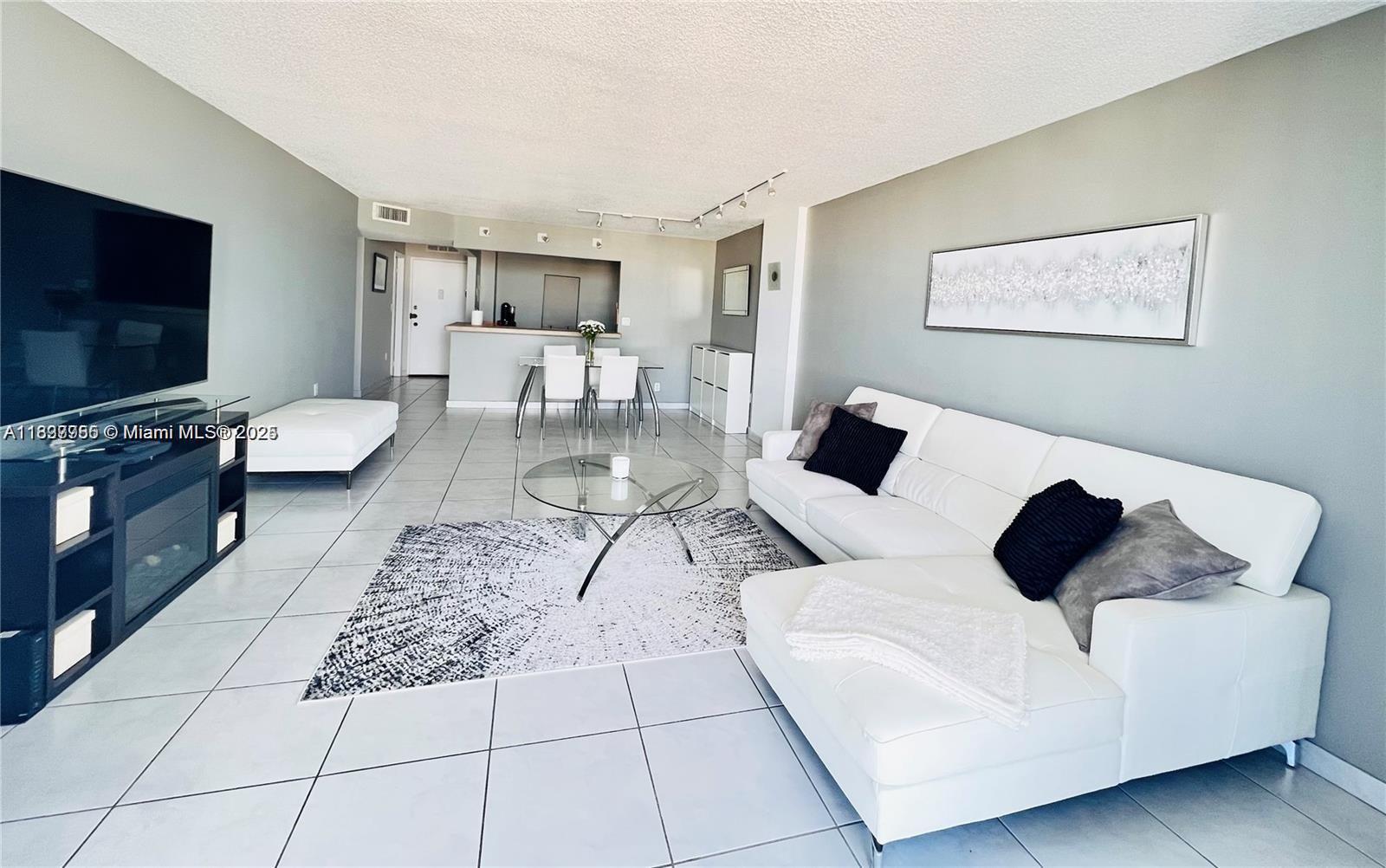 Renovated bright and spacious 1 bedroom 1.5 bathroom apartment for sale in heart of Aventura! Unit features open kitchen, stainless steel appliances, tile floors, upgraded bathrooms, spacious balcony with beautiful city views from the 20th floor, lots of closet space. Cable and ultra fast fiber internet are included, as well as covered parking. Building offers 5 star amenities: fitness center, tennis court, 2 pools, courtyard overlooking the intercoastal, which has boat access. Walk to Fresh Market, restaurants, shopping and entertainment, enjoy the walking trail around the intercoastal and Williams Island. Aventura Mall is 1.3 miles away. Call today!