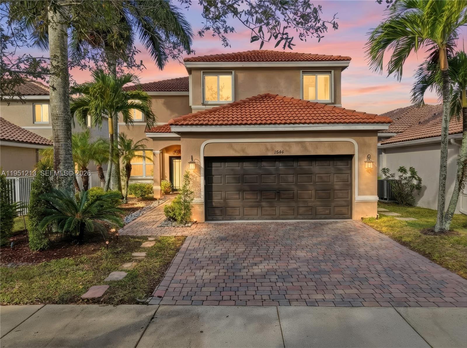 Welcome to this beautifully updated home in the heart of Weston, offering peace, privacy, and move-in-ready confidence. Enjoy major updates including a new roof, new A/C system, new hurricane-impact windows and doors, plus accordion shutters for full storm protection. The fully fenced backyard with no neighbors behind provides privacy and breathtaking sunset views, creating the perfect setting for relaxing evenings and safe outdoor play. With solid core updates already in place, the home still offers room for the next owner to add their own personal style and finishing touches. As a pleasant surprise, discover unique storage space tucked under the stairs, a charming and practical feature rarely found. Residents enjoy access to resort-style community amenities, including a heated Olympic-size lap pool, large water slide, kiddie pool, on-site lifeguards, mini golf course, basketball courts, pickleball courts, and a café at the clubhouse, offering a truly active, amenity-rich lifestyle. Located in a community served by top-rated A schools, this home blends smart updates, thoughtful features, and a tranquil setting in one of Weston’s most coveted communities. This home is ready for its next chapter. Perhaps it’s yours.