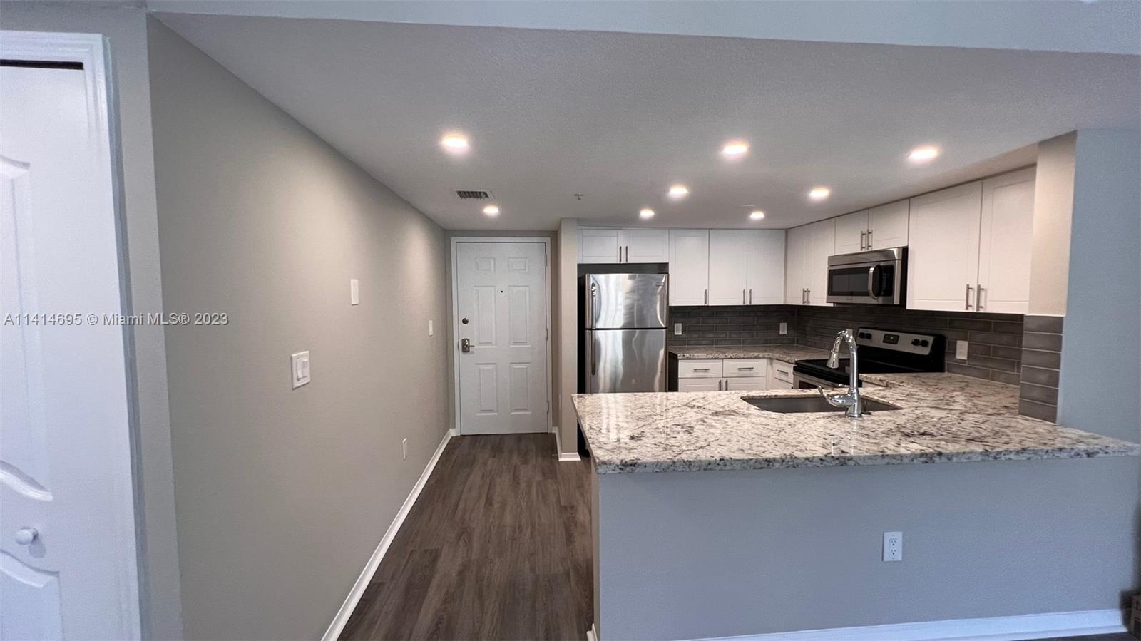 Beautifully renovated 2 bedroom/2 bathroom by Marlins Park centrally located to everything!: Brickell/Downtown/Hospitals/Major Highways. Unit comes with 2 covered and secured parking spots inside of private garage. Unit also has full washer/dryer and fully equipped kitchen with granite countertops. Management here is great and building is quiet.