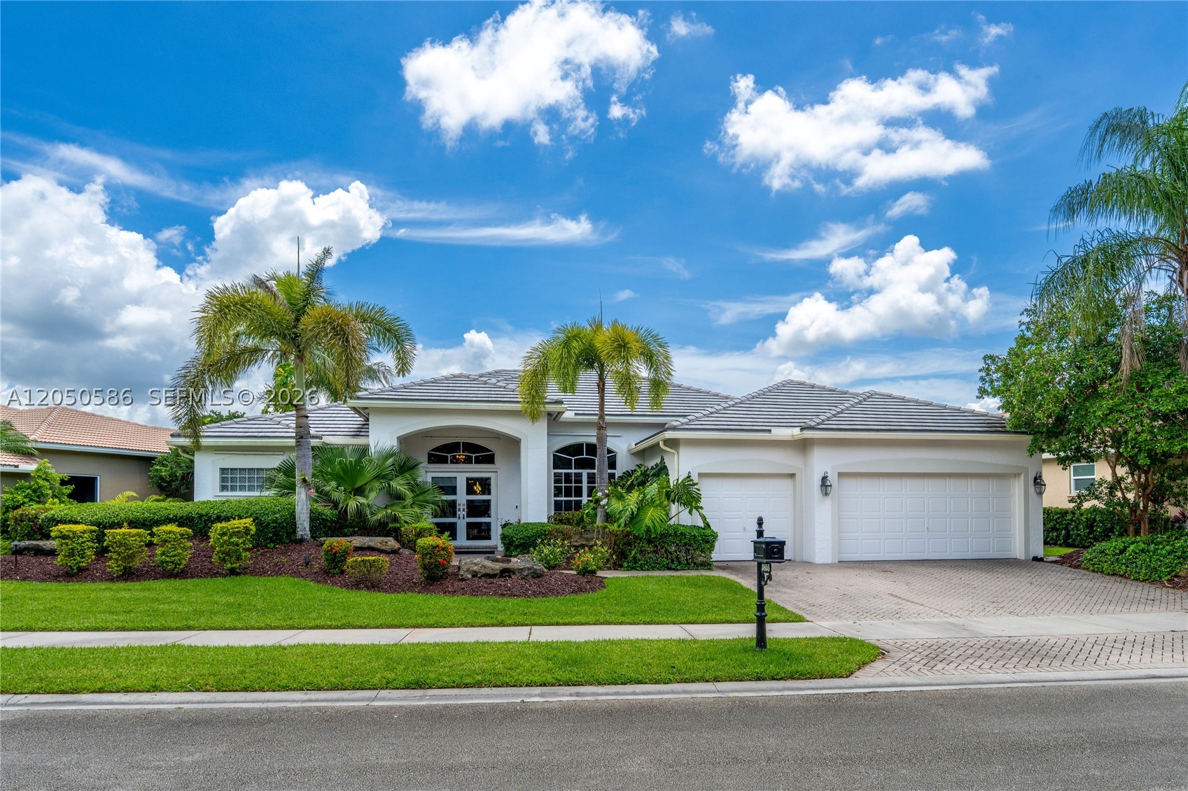 Stunning waterfront views from this fully renovated five-bed plus an office, three-bath home in The Ridges. Set on a private oversized lot, this move-in-ready home features a bright triple-split floor plan with high ceilings and abundant natural light. The gourmet kitchen features stainless steel appliances, extensive cabinetry, and a large, beautiful island. Recent upgrades include upscale custom cabinetry, NEW ROOF, two A/C systems (2019 and 2021), porcelain tile flooring in the main living areas, and vinyl flooring in the bedrooms. The outdoor living area is designed for year-round enjoyment, featuring a heated pool, screened patio, and travertine deck overlooking the lake. Complete with a three-car garage and located in a premier gated community with resort-style amenities and A-rated schools.