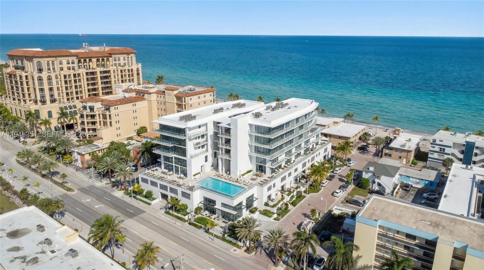 502 | 2BD / 2.5BA | 1,103 SF | South | 1 Parking Spot. Residence 502 is the
balanced, high-demand layout that checks every box: 1,103 SF, two true
suites, and a dedicated powder room for guests—plus a bright south exposure
that brings light into the main living areas. The balcony creates that effortless
beachside cadence—open the sliders, let the breeze in, and live the way you
came to the coast for. Renderings highlight a refined modern
interior direction: warm neutral tones, soft recessed ceiling lighting, and spa-
style bath finishes (sleek vanity lines, oversized surfaces, frameless glass
shower details). ETURNA Beachside is boutique development—7 stories, 36
residences, ocean side of A1A. Building amenities include resort-style
swimming pool, fitness center, sauna, cold plunge, 24/7 front desk concierge
and beach club service. Conviniently located steps to the sand and the
Hollywood Broadwalk, 10 minutes away from FLL Airport. Flexible rental policy
min 30 days. Delivery Q2 2026. Renderings for illustration; subject to change.