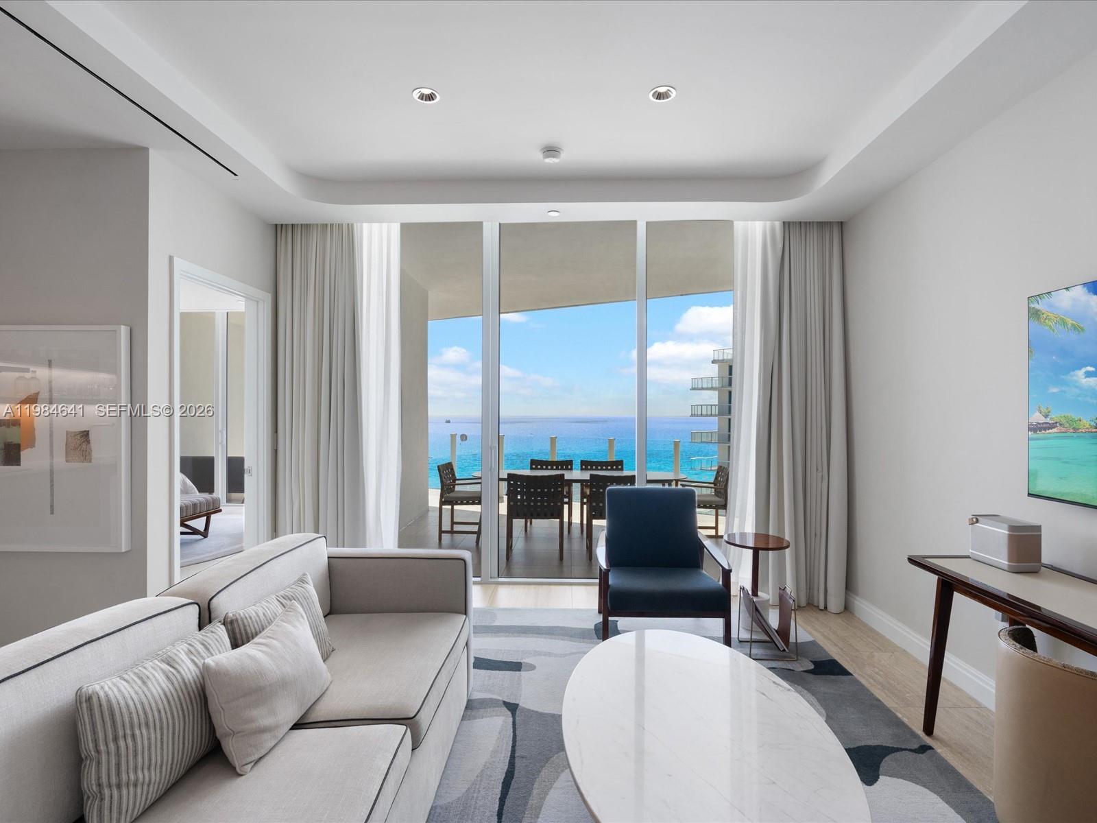 A refined coastal residence within the prestigious Four Seasons Private Residences Fort Lauderdale, where world class service meets effortless oceanfront living. Positioned along one of South Florida’s most coveted stretches of beachfront, this residence offers a seamless blend of modern design expansive interiors and resort level amenities.

Spanning over 1,800 interior square feet with an additional 600 plus square feet of private terrace space, the home is designed for both comfort and elevated entertaining. Floor to ceiling glass frames sweeping ocean and city views while the open concept great room flows into a sleek chef caliber kitchen featuring premium appliances custom cabinetry and stone finishes. Two private suites each with dressing rooms and spa-inspired baths provide a tranquil retreat with a focus on privacy and refinement.

A deep terrace extends the living experience outdoors ideal for sunrise mornings and coastal evenings capturing the essence of Fort Lauderdale beachfront living.

Residents enjoy access to Four Seasons signature services and amenities including a resort style pool spa and wellness facilities fitness center concierge valet and in residence dining and housekeeping delivering a fully serviced lifestyle defined by ease discretion and sophistication.