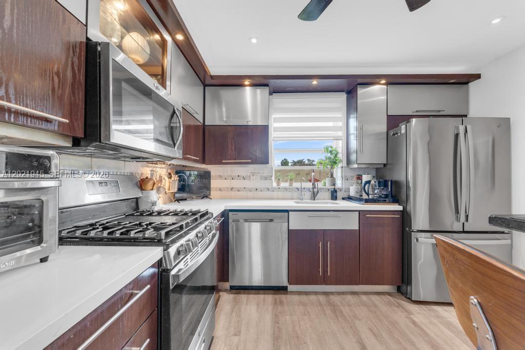 The moment you walk through the front door, the peaceful CANAL view immediately draws you in. This beautifully UPDATED WATERFRONT TOWNHOUSE offers the perfect blend of comfort, privacy, and convenience in the highly desirable Kendall West area.

Filled with NATURAL LIGHT, the home features MODERN FINISHES and a thoughtfully designed layout ideal for everyday living and entertaining. Upstairs, BOTH BEDROOMS ARE SUITES WITH CUSTOMIZED CLOSETS. The primary suite also has a WALK-IN CLOSET.

Downstairs, a half bath for guests, SEPARATE LAUNDRY ROOM WITH FULL SIZE WASHER AND DRYER, and ADITTIONAL STORAGE under the stairs add valuable functionality. Buyers will also appreciate that the kitchen range and the dryer both run on natural gas, not electricity.

Located in the GATED Centre Court community with NO PET RESTRICTIONS. The community POOL is right by the end of the block. INVESTORS MAY RENT IT IMMEDIATELY. It is also directly across from OLYMPIC PARK and minutes from Kendall Drive, shopping, dining, schools, hospitals, and the library. This MOVE-IN READY home offers the lifestyle, location, and value buyers are looking for.