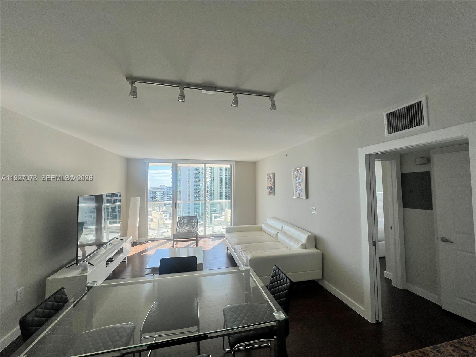 Amazing water views of ocean Biscayne Bay, and city. This fully furnished unit features dark wood floors, stainless steel appliances, and custom closet cabinetery. The apartment will be delivered freshly painted and with brand-new shades. Two parking spaces, one assigned and one valet. The pool is currently closed during to construction. SHORT TERM AVAILABLE.