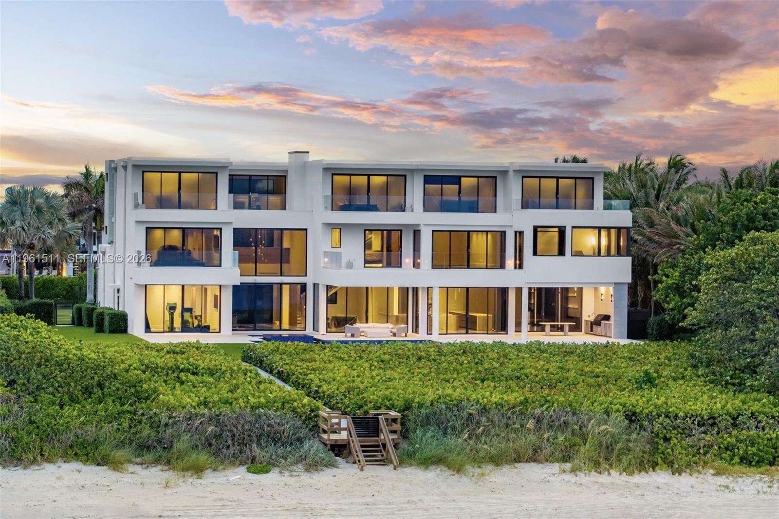 Rising above the Atlantic along Florida’s famed Millionaire’s Mile, this ocean-to-Intracoastal estate is a triumph of scale & sophistication, ranking among the most significant waterfront residences offered in South Florida. Set on 1.38 acres (60,200 sqft) with 140 feet of direct ocean frontage & 140 feet along the Intracoastal, the property offers rare dual-water exposure in a prestigious coastal setting.

The newly upgraded 10,101 sqft residence reflects uncompromising attention to detail, elevating beachfront living to an exceptional standard. Spanning three curated levels, the home blends timeless elegance & modern craftsmanship. Seven expansive ensuite bedrooms and eight-and-a-half baths showcase refined finishes, including two exceptional primary suites, one a grand retreat with spa-inspired his-and-hers baths & oversized walk-in closets, along with onyx-clad fireplaces, a Crystallo marble powder room, TOTO Neorest suites, dual laundry rooms, & walls of glass framing uninterrupted Atlantic views.

Positioned 16 ft above sea level, the estate pairs architectural beauty with lasting strength. Manicured grounds lead to a resort-style pool and spa, private beach path, & new seawall and dock, providing seamless access to both ocean and protected waterways. Interior amenities include a state-of-the-art theater & an eight-car showroom garage.

A true legacy property & rare opportunity to own a landmark estate along South Florida’s most distinguished coastline.