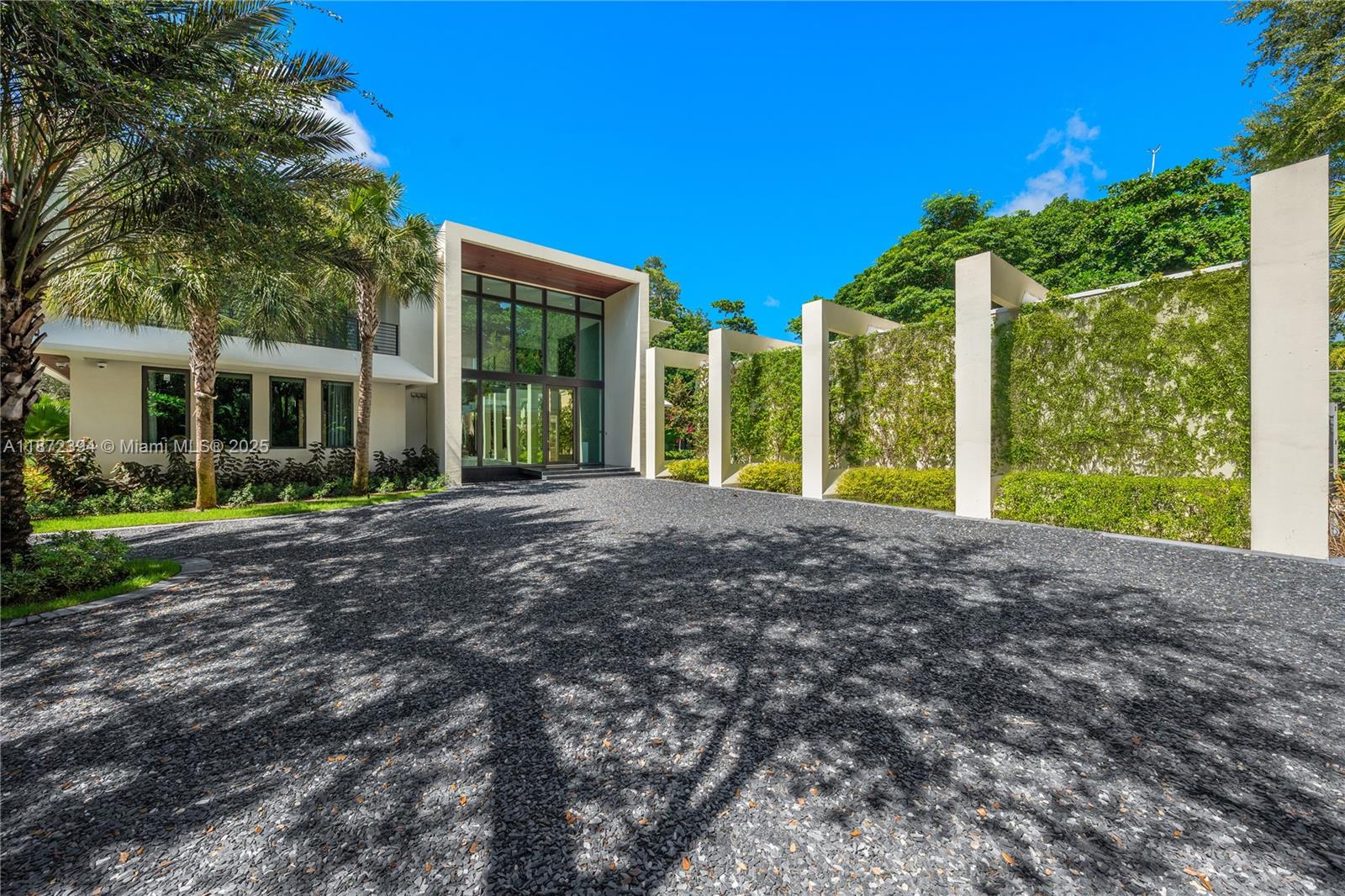 Architecturally striking new contemporary in Journey’s End offers rarity, cachet & grandeur on 1.728 acres with 24-hr guard gate, marina w deeded boat slip and 2 tennis courts. One of only 18 estates in this exclusive enclave, enter through walls of glass to a floating-staircase foyer & soaring 23’ ceilings, framing lush park like gardens & enormous resort style pool.  Expansive limestone slab floors seamlessly connect the grand living, dining & family rooms w Snaidero kitchen, complemented by 3 oversized ensuite bedrooms, a media room, powder room & laundry.  Upstairs white oak unifies ethereal primary suite with spa bath, dual vanities, water closets & walk-ins + 3 expansive en-suite bdrms. Detached 4-car garage, 75x25’ pool. Privacy, exclusivity & abundance define this elite estate.