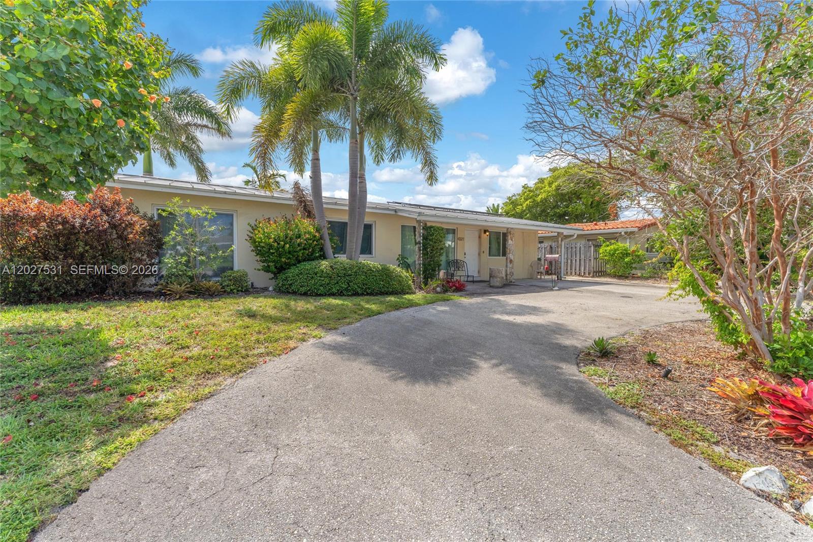 Charming waterfront pool home tucked away at the end of a quiet, low-traffic street! This spacious property features 3 bedrooms, 2 bathrooms, plus a Florida room and a versatile den that can easily be converted into a 4th bedroom, office, or guest space. Conveniently located near major highways, shopping, dining, entertainment, and South Florida’s beautiful beaches. The home offers a heated pool, terrazzo and tile flooring throughout, and a newer solar panel roof installed just 2 years ago. Enjoy serene canal frontage with closed bridges (no ocean access and no dock). The circular driveway provides ample parking for 3–4 vehicles. 

ROOF 2019/THANKLESS WATER HEATER 2019/ SOLAR PANELS 2023/ IMPACT WINDOWS 2021/ WASHER AND DRYER 2025