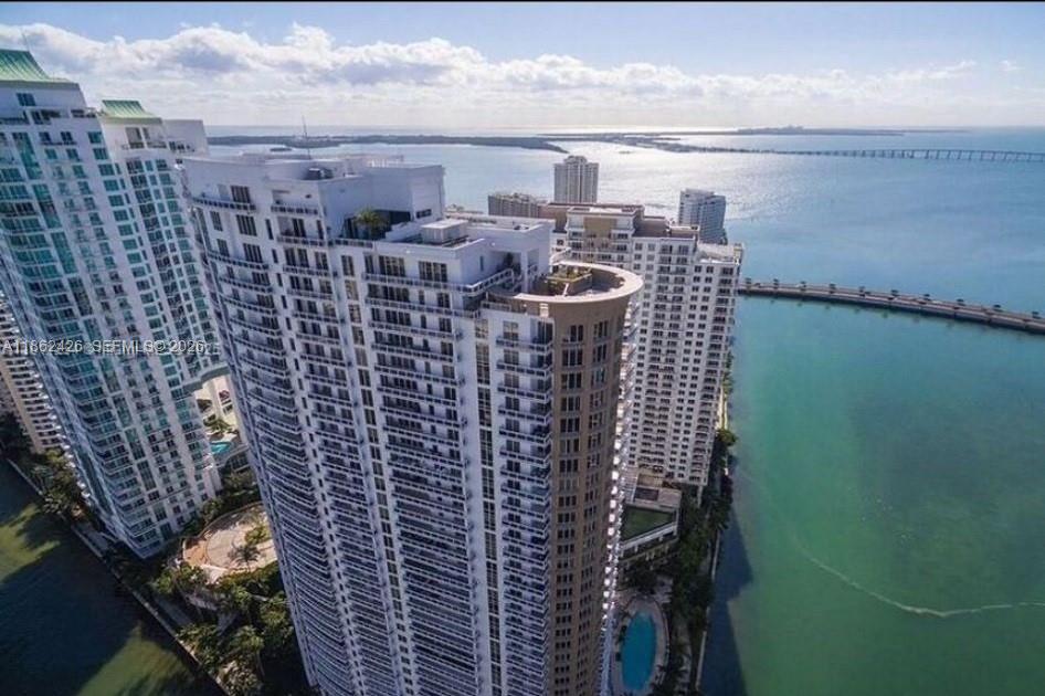 Luxury 1-bedroom, 1.5-bath condo on exclusive Brickell Key. Features 1,030 sq. ft. with marble and wood floors, European kitchen, marble bath, plus a 200 sq. ft. balcony overlooking Biscayne Bay and the Miami skyline. Queen bed in main bedroom, 2 flat-screen TVs with full cable. Dining seats 10, living room seats 5. Building offers gym, pool, spa; island has paths, market, restaurant, playground, shops. No dogs. 5 minute walk to Brickell via bridge, Brickell key is it's own private island. Enjoy 5-star resort amenities, serene island ambiance, 24/7 security, and unparalleled access to Miami’s vibrant urban lifestyle—all from the privacy of this upscale waterfront residence.