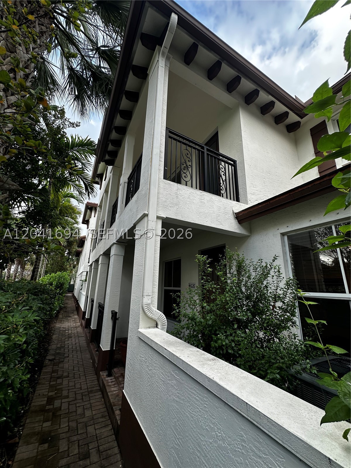 Luxury Townhouse in the prestigious gated community of Paloma Lakes in Vibrant Coconut Creek. Located right across the street from the Promenade shopping plaza, ensuring you are just steps away from shopping, movies, dining, and entertainment. Enjoy the convenience of being minutes from major highways, A-rated schools, grocery, retail and drug stores. Don't miss this exceptional opportunity to live in one of most desirable neighborhoods in the area. 3 spacious bedrooms and 2.5 Batrooms, Stainless Steel appliances, 2-car garage with storage, EV Charger connection ready, title & beautiful upstairs floors, in-unit washer and dryer for your convenience. Two serene lakes close to the property, gorgeous pool, and scenic sidewalks perfect for walking and enjoying the neighborhood.