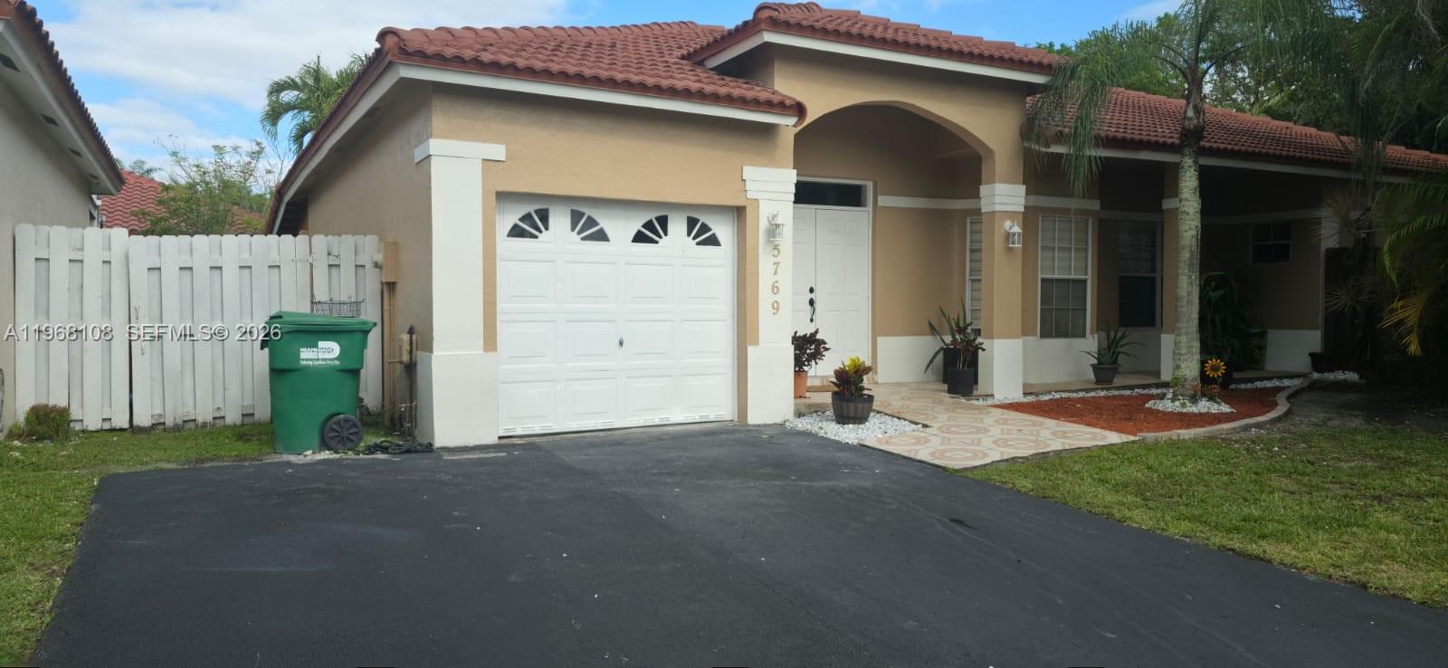 Stunning corner single-family home located in Doral Pines, one of the 13 exclusive communities within prestigious Doral Park. This 3-bedroom, 2-bath residence offers serene golf course views, a bright open layout, remodeled kitchen and bathrooms, elegant flooring, and a converted garage ideal for office or flex space. Enjoy a private Florida room and patio overlooking lush fairways, perfect for relaxing or entertaining. Residents enjoy access to the Doral Park Clubhouse featuring resort-style amenities including pool with bar, jacuzzi, gym, sauna, tennis and pickleball courts, elegant event salons, and a children’s water park on weekends — delivering an elevated lifestyle experience. Low monthly fees provide exceptional value, including HOA $270 and Clubhouse access $105. Prime location near top-rated schools, shopping, dining, and major highways. As an added benefit, the seller is offering a contribution of $5,000 toward the buyer’s closing costs.