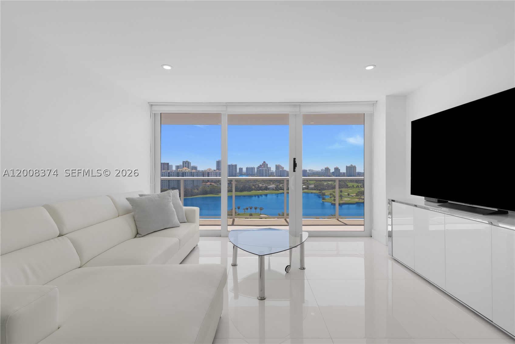 Step into luxury with this impeccably remodeled split bedroom, 2-bed, 2-bath residence at the prestigious Flamenco Condo in Aventura. Boasting an expansive balcony with breathtaking views of the exclusive Turnberry Golf Course, this unit is designed for elegance and comfort. Sleek white large-format tile flows throughout,complementing the modern kitchen with custom cabinetry, granite countertops, and top-tier stainless steel appliances. Spa-inspired bathrooms feature glass enclosures for a refined touch. Offered fully furnished with contemporary décor, this home is move-in ready. Enjoy scenic walks along the 3-mile golf course path or indulge in world-class shopping and fine dining just minutes away at Aventura Mall. A rare opportunity for sophisticated living—don’t miss it!
