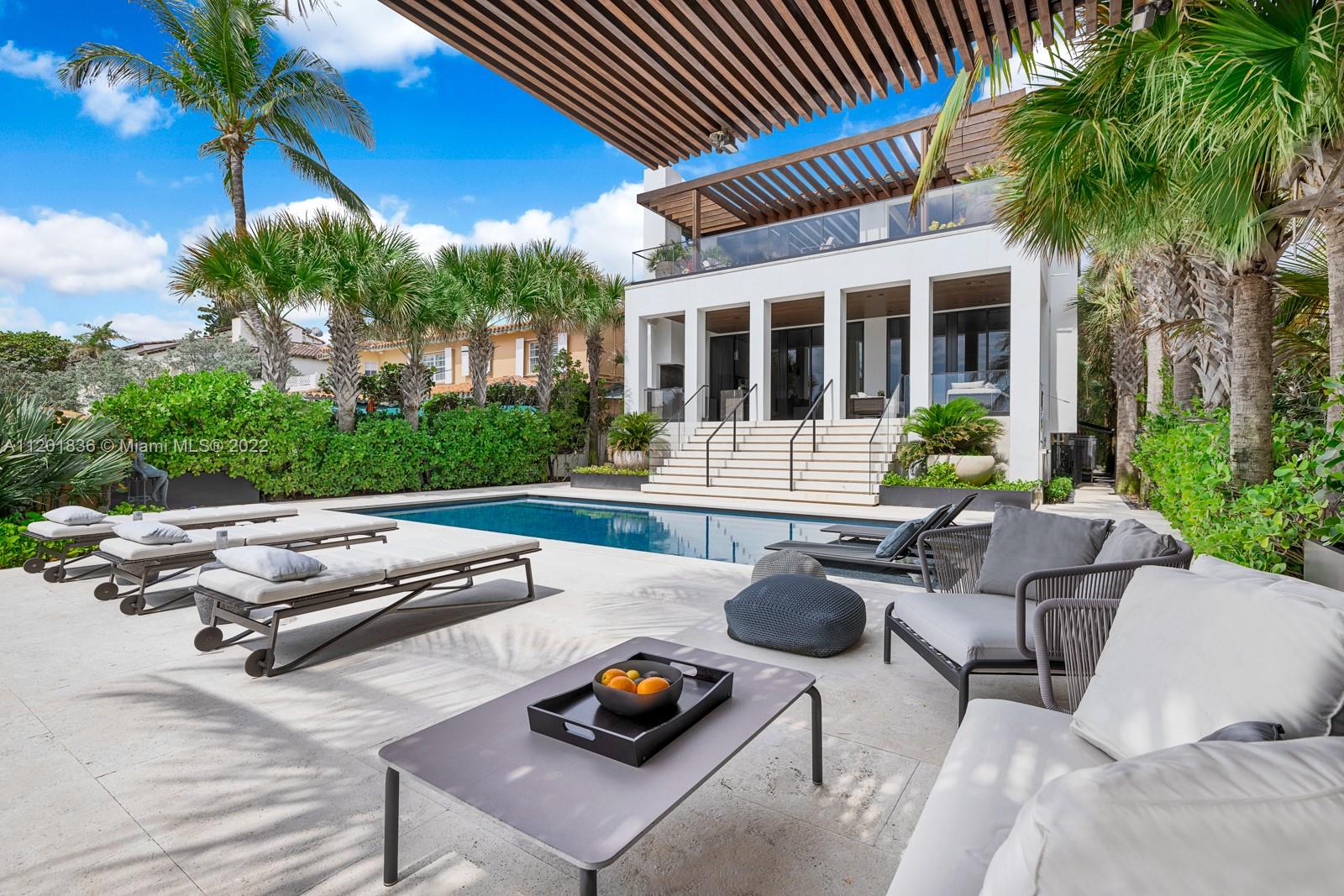 A unicorn property on the 4-block stretch of Golden Beach’s private sand. This Architectural Digest cover story was curated in 2020 by design’s elite: Wecselman, KoDA, Enea. The 7,300sf redefined space offers glamorous oceanfront living lounges, a celebrity-style primary suite + office, and a lower level fit for an autophile/fitness fanatic. The aesthetic of the kitchen & primary bath are authentically outstanding, as is the significant staircase. Toothbrush-ready interiors are magnified by the pleasures of the outdoors - a seaside swimming pool, spacious verandas, Summer kitchen, and beachside louvered cabana. The superb elevation is to be admired, while the sounds of the ocean, the sight of the moon, and the sunrises to be revered. For the most discerning visionary, this can be home.