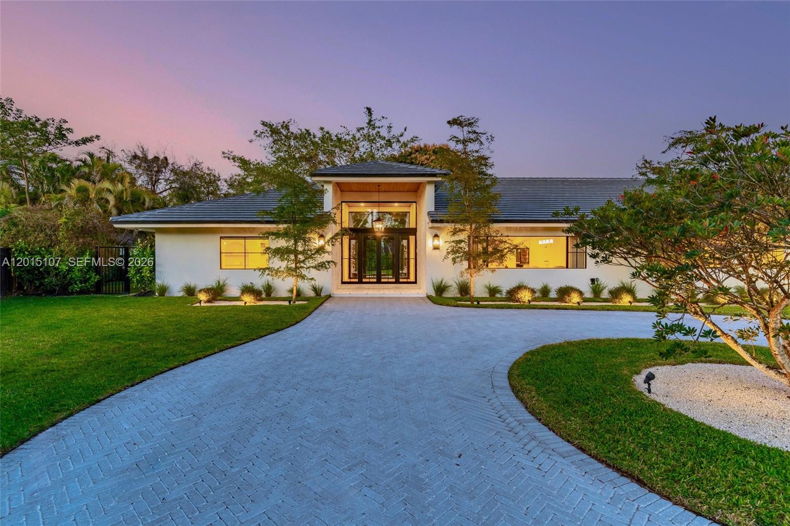 Introducing a fully custom one-story Organic Modern estate unlike anything Palmetto Bay has seen! This stunning singlestory home blends warmth and craftsmanship from the moment you arrive, featuring dramatic floor-to-ceiling stonework, herringbone foyer floors, and views of the private courtyard and fire pit upon entry. With nearly 4,000 SF under air, expansive living and dining areas with vaulted ceilings flow seamlessly into the open family room and chef’s kitchen complete with custom cabinetry, leathered quartzite countertops, a statement Lofra range, paneled Thermador appliances, and an oversized breakfast nook overlooking the pool and backyard. A versatile office/playroom, three secondary bedrooms with two beautifully finished baths, and a spacious primary suite with sitting area, dual walk-in closets, and spa-like bath complete the interior. Exquisite landscaping with curated landscape lighting elevates the home day and night, while Venetian plaster accents, designer hardware, a 5,000 SF driveway, over half an acre with plenty of yard, and a 2 car garage complete this exceptional residence, setting a new standard in Palmetto Bay. Designed by WeRemodelit Co. Near Miami's Top Rated schools and within close proximity to Deering Estate and Hiking / Biking trails.